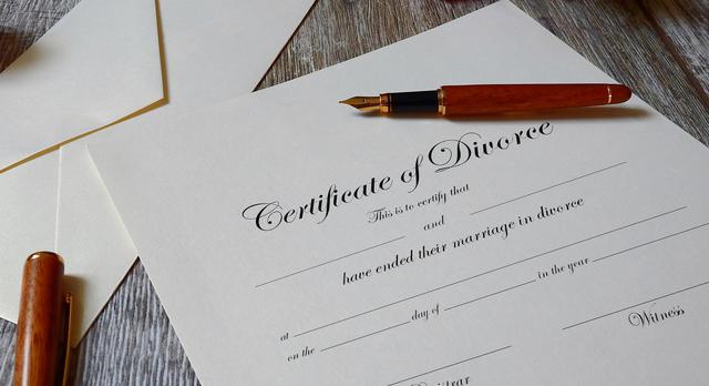 certificate of divorce on table with open pen