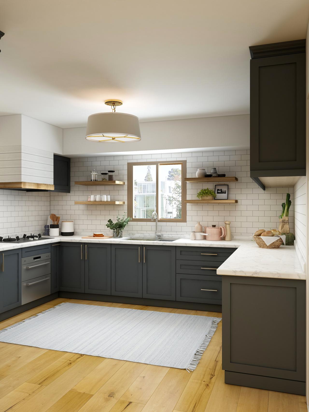 A kitchen with a hardwood floor and black cabinets and drawers.