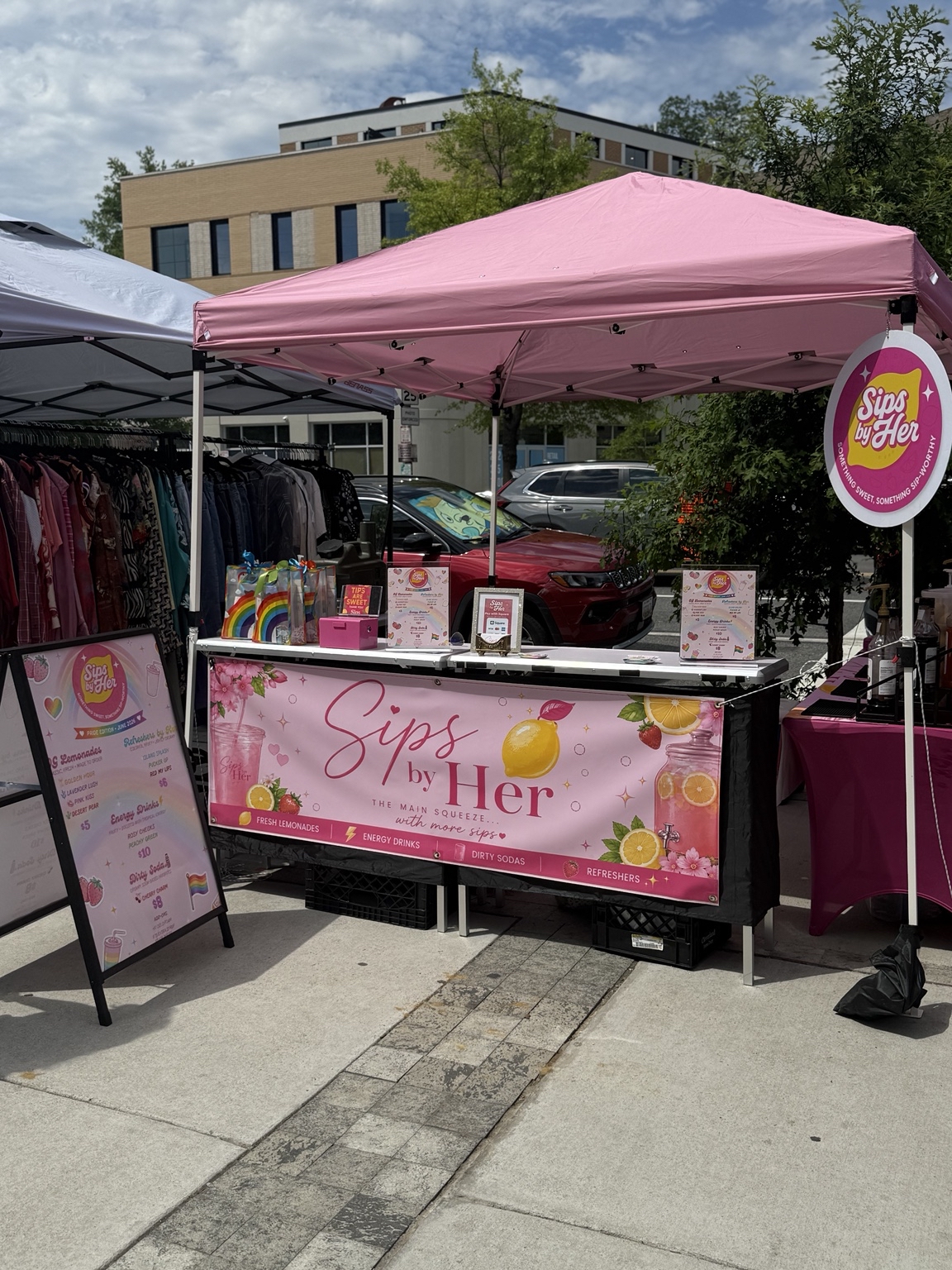 Sips by Her pink booth and setup