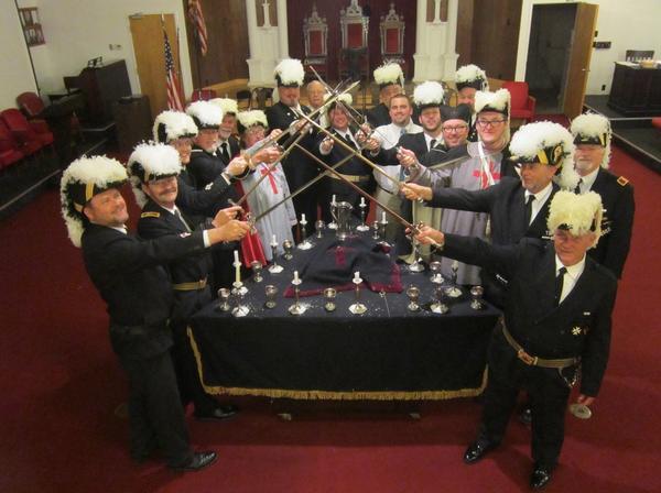 Contemporary Masonic ceremonial gathering in a grand hall with modern members and regalia