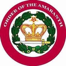Order of the Amaranth emblem featuring a five-pointed star with amaranth flower symbolizing immortality and feminine leadership with gold detailing