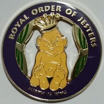 Royal Order of Jesters emblem featuring a jester's cap with bells and masonic symbols with gold detailing
