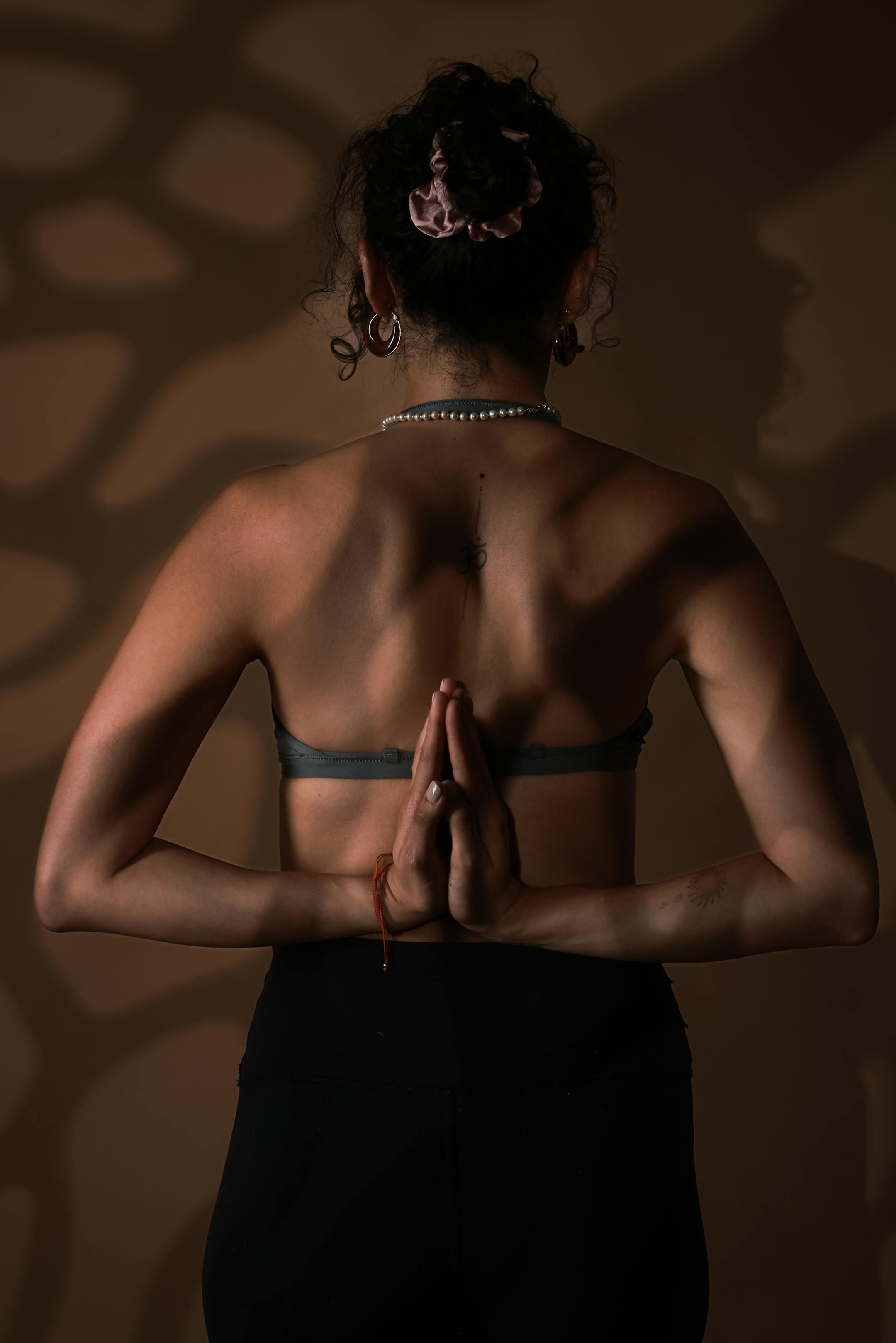 A woman practicing yoga in a serene pose, promoting balance and mindfulness.