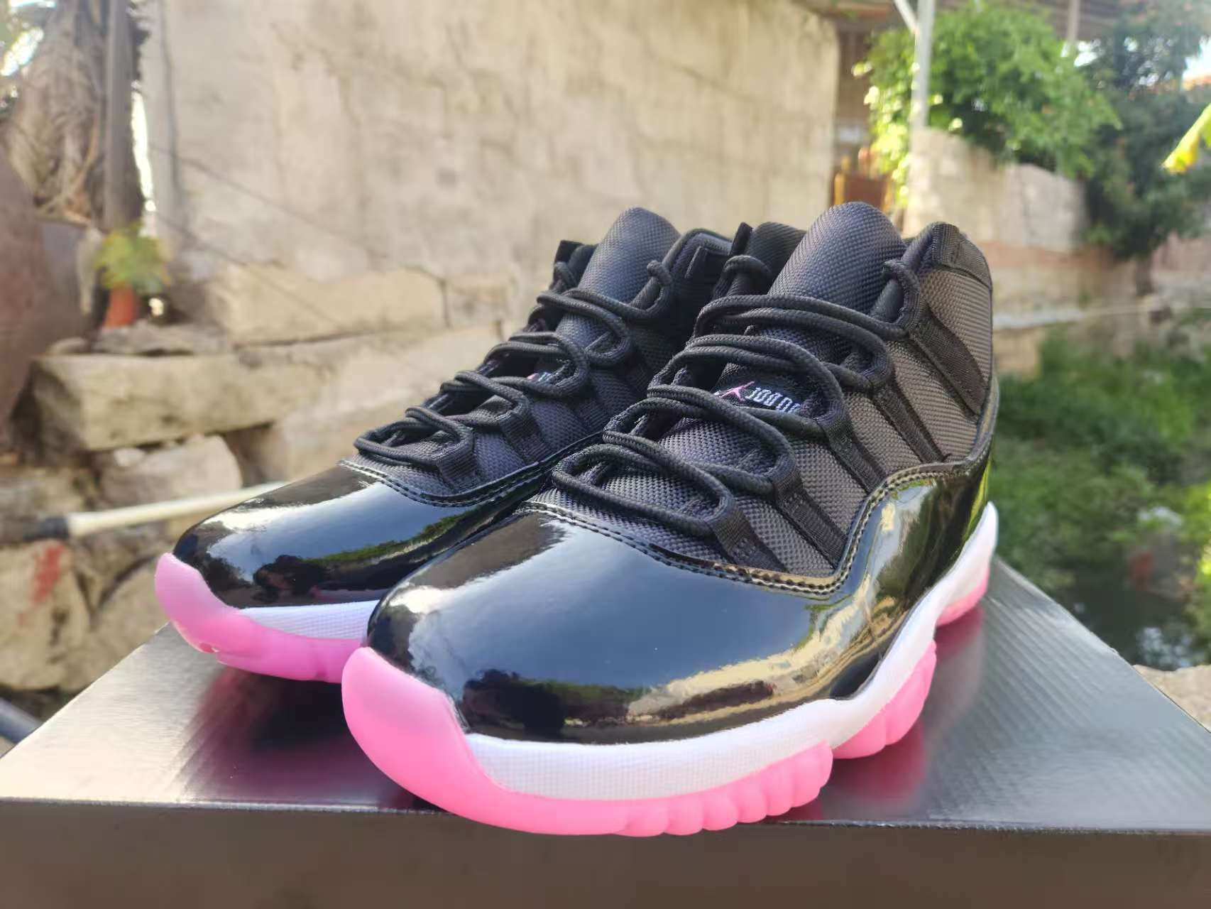 Air Jordan 11 Retro Pink Jam Custom alternate angle – black patent leather pink outsole detail