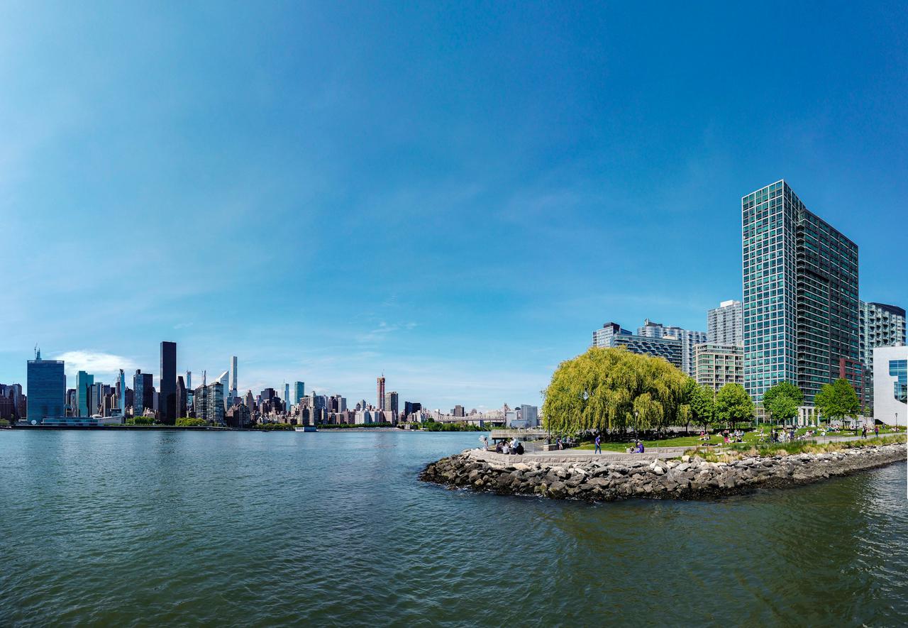 Panorama of the view from Long Island City, in New York City. A blue beautiful day during the epidemic of COVID-19.
