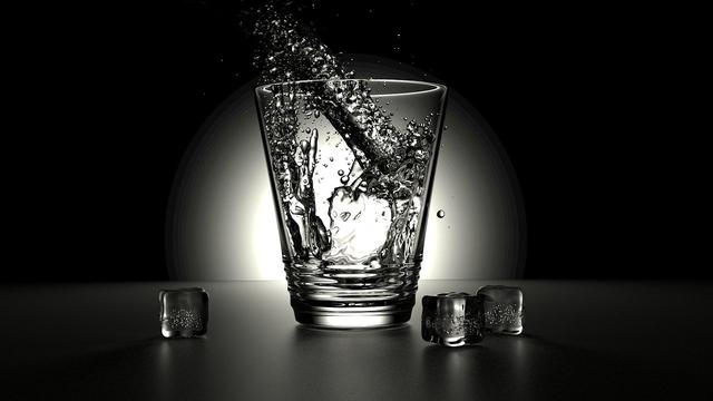 Water pouring into a glass.