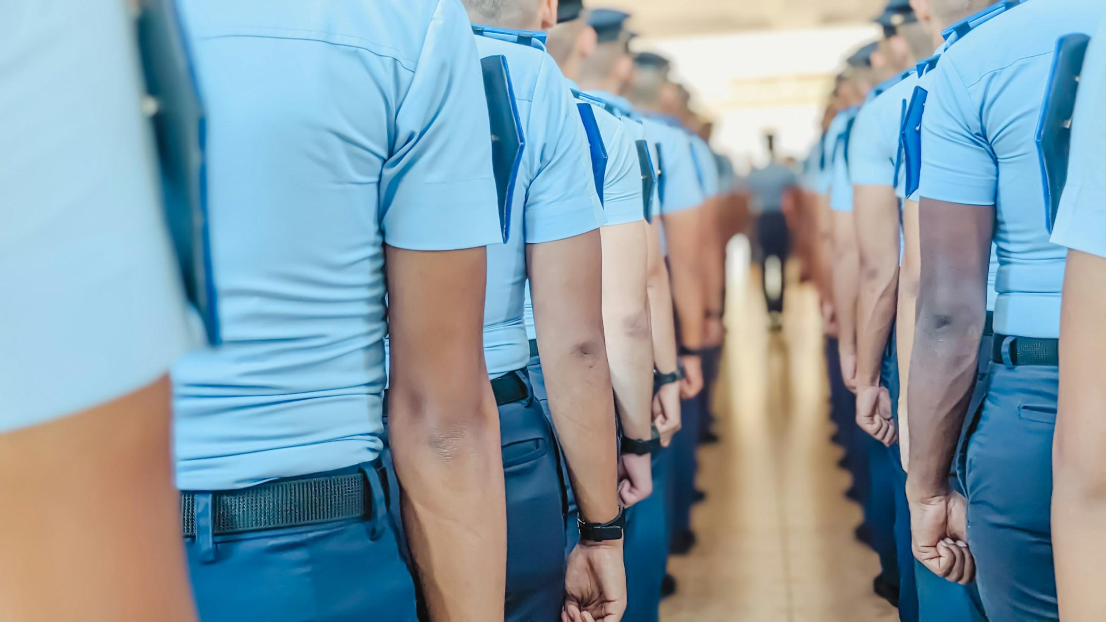 Selective focus. Rear view of The line of Vocational Cadets in uniform waiting for the leader briefing on the Morning Assembly