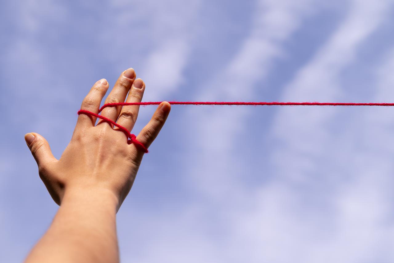 human-hands-connected-with-red-thread-5.jpg