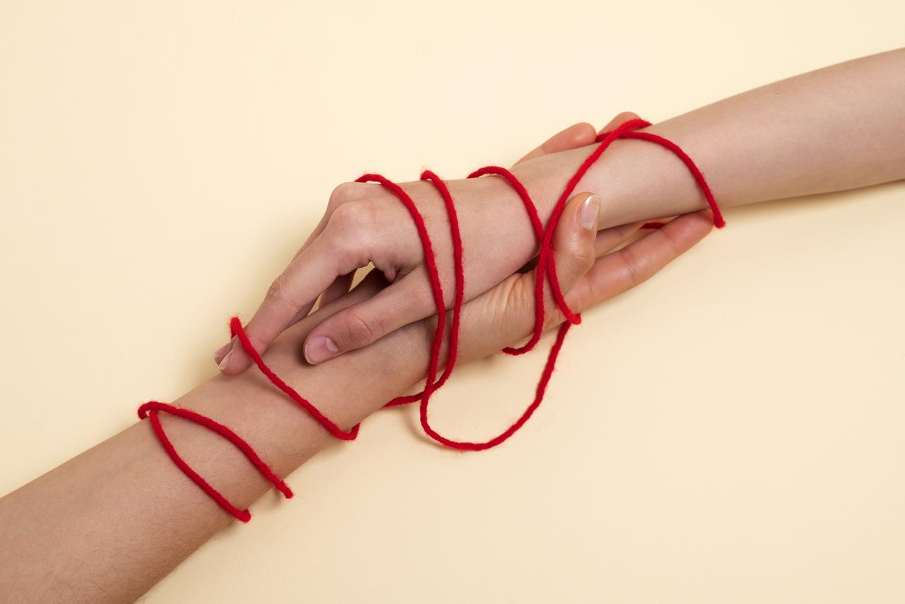 human-hands-connected-with-red-thread-4.jpg