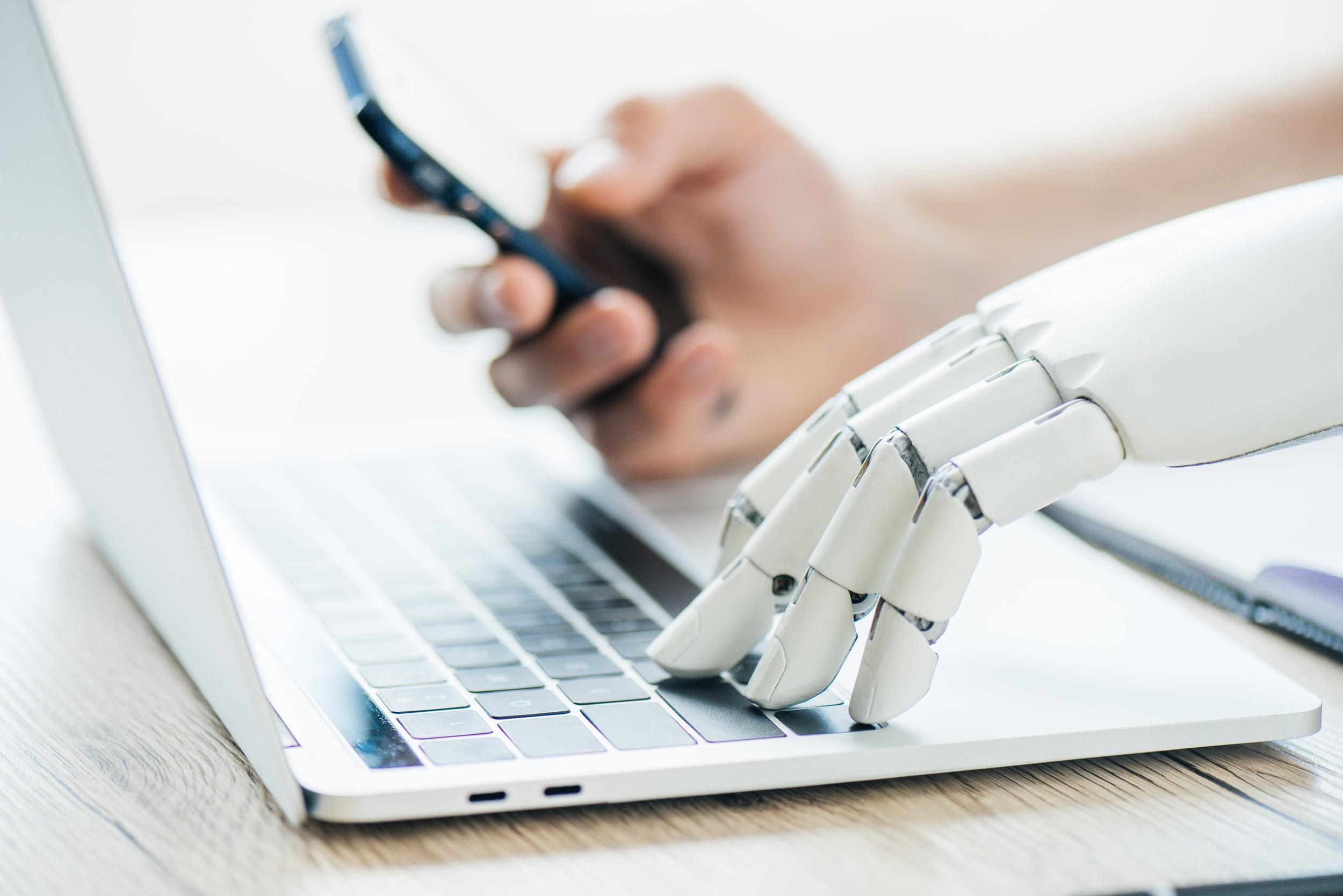 close-up-view-of-human-and-robot-hands-using-smart-2024-11-17-15-30-35-utc.jpg