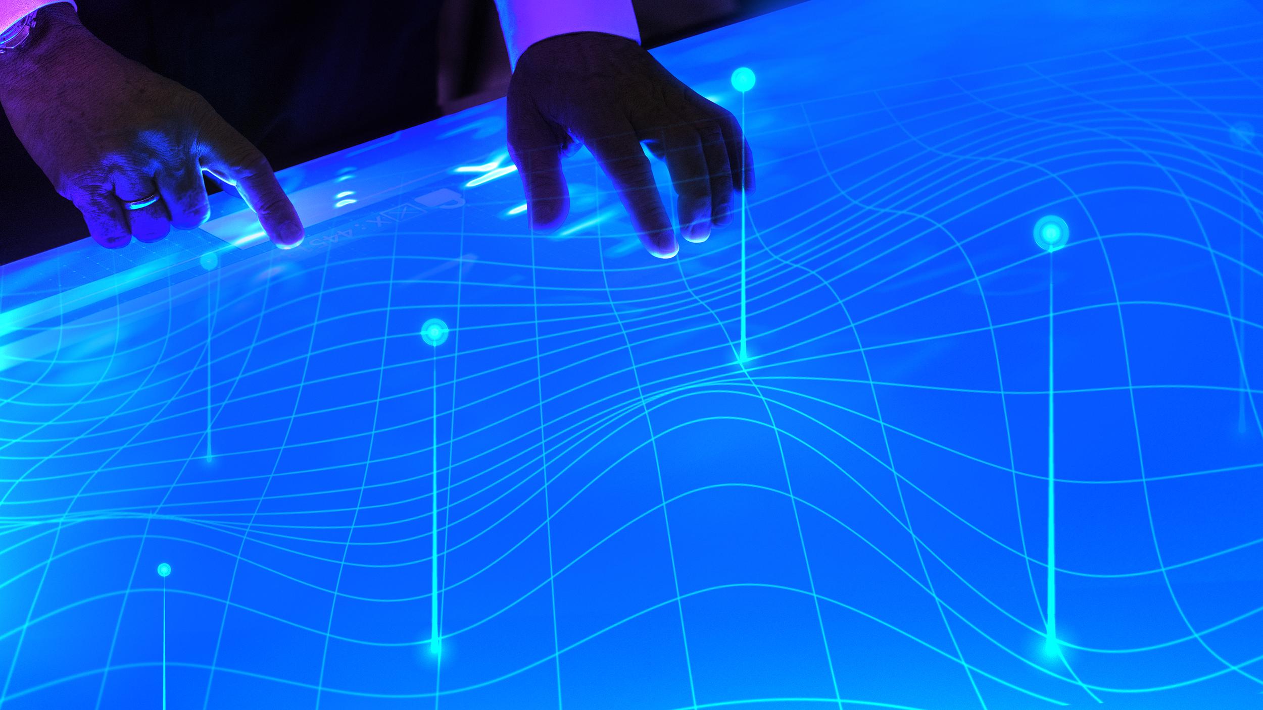 man-touching-the-futuristic-blue-screen-2025-02-09-23-50-47-utc.jpg