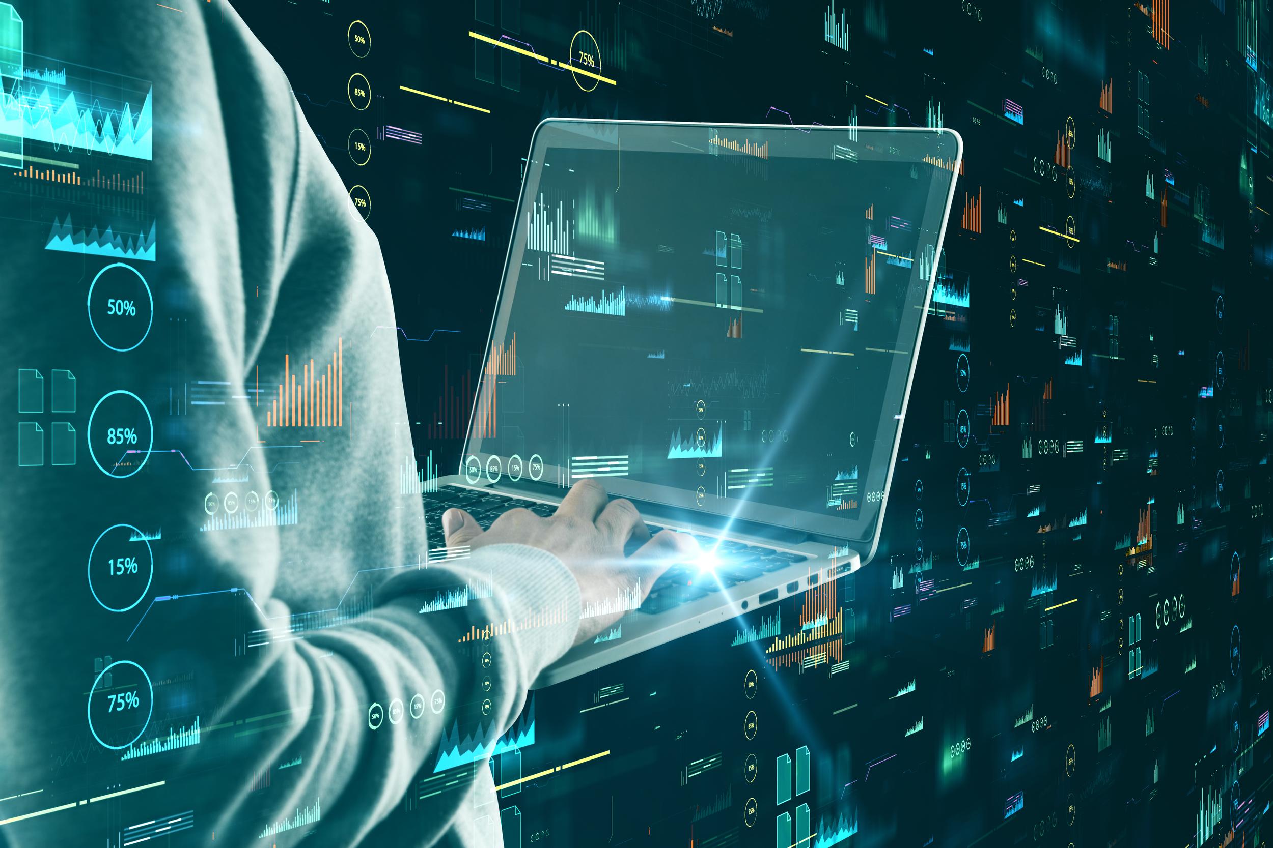 hacker-using-laptop-with-glowing-digital-business-2026-01-11-08-36-49-utc.jpg