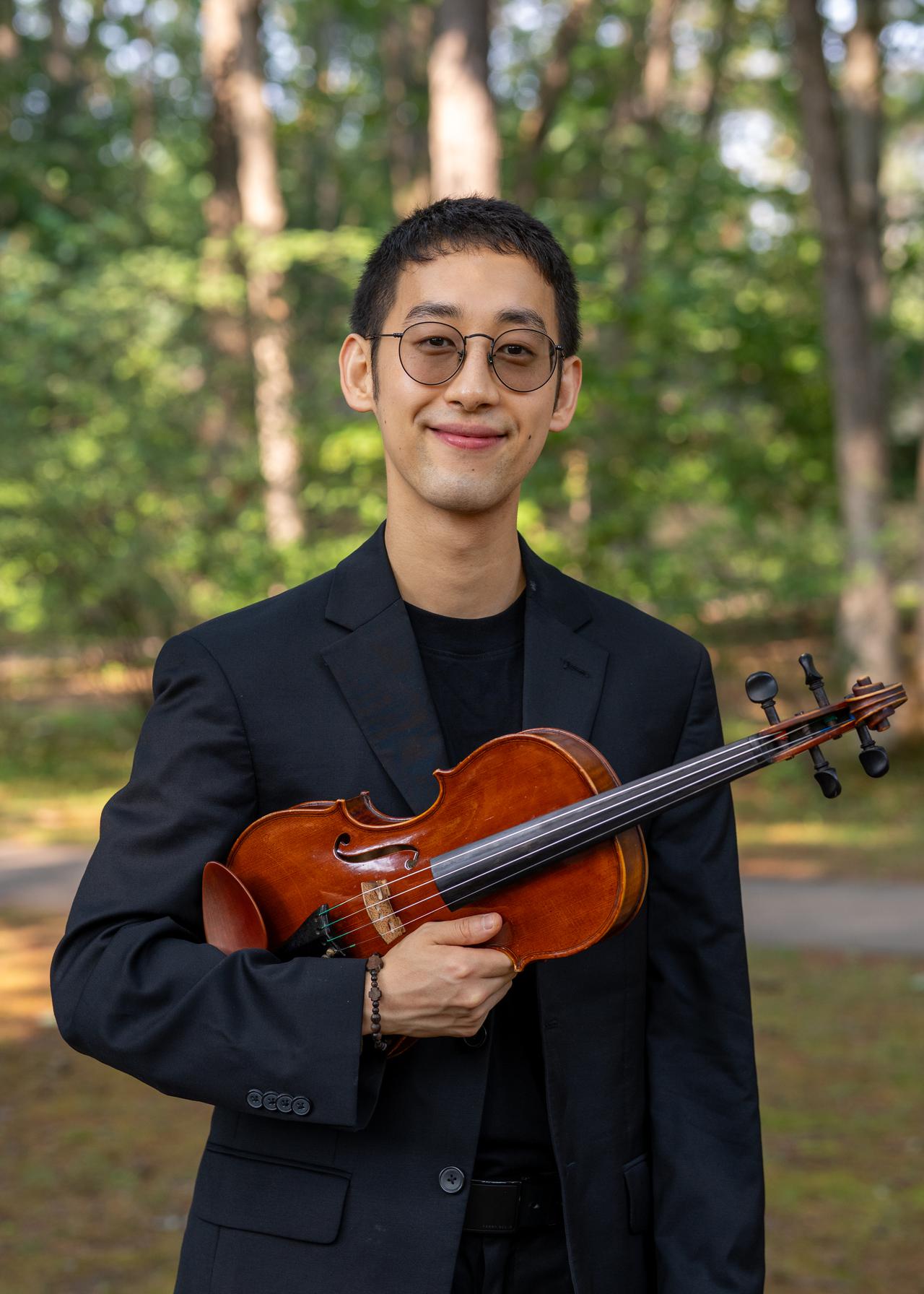 martin forest head shot with violin smiling.jpg