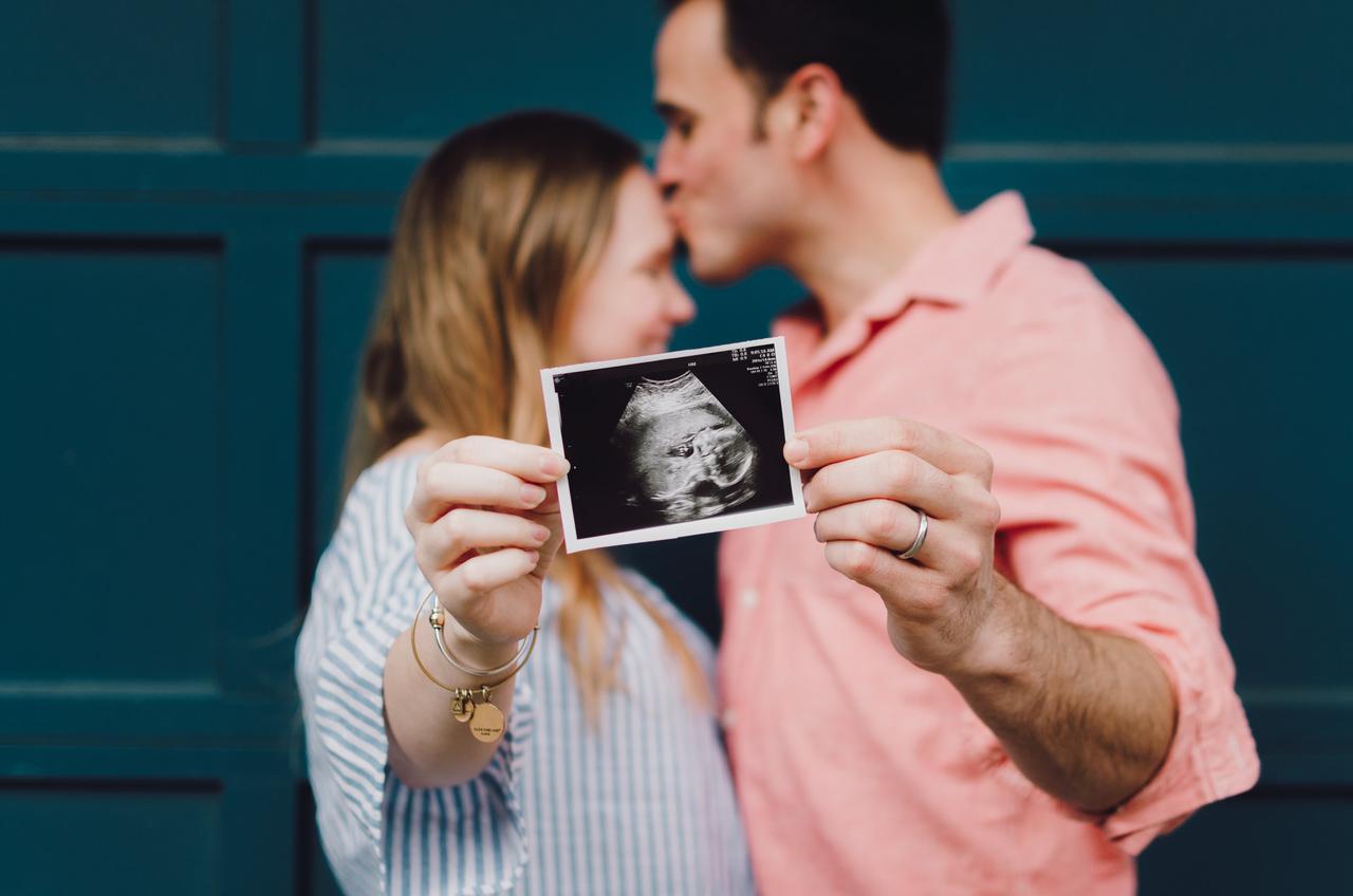 Some friends of mine holding an ultrasound picture of their sweet baby