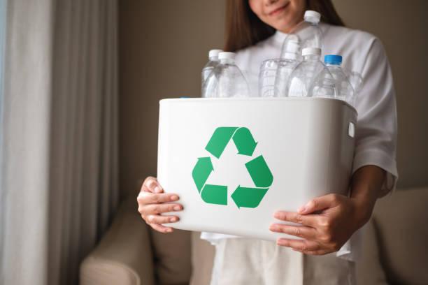 woman holding recycling bin.jpg