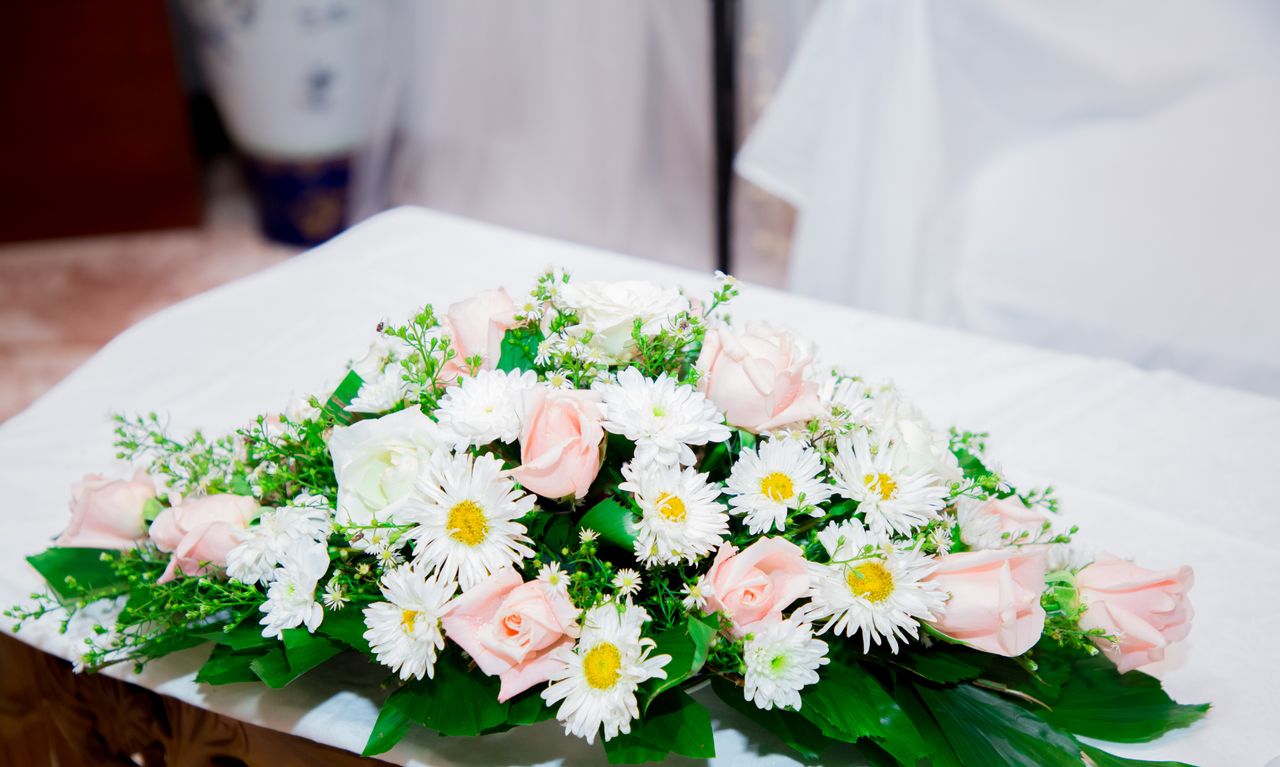 Delicate white and sage-green bridal arrangement
