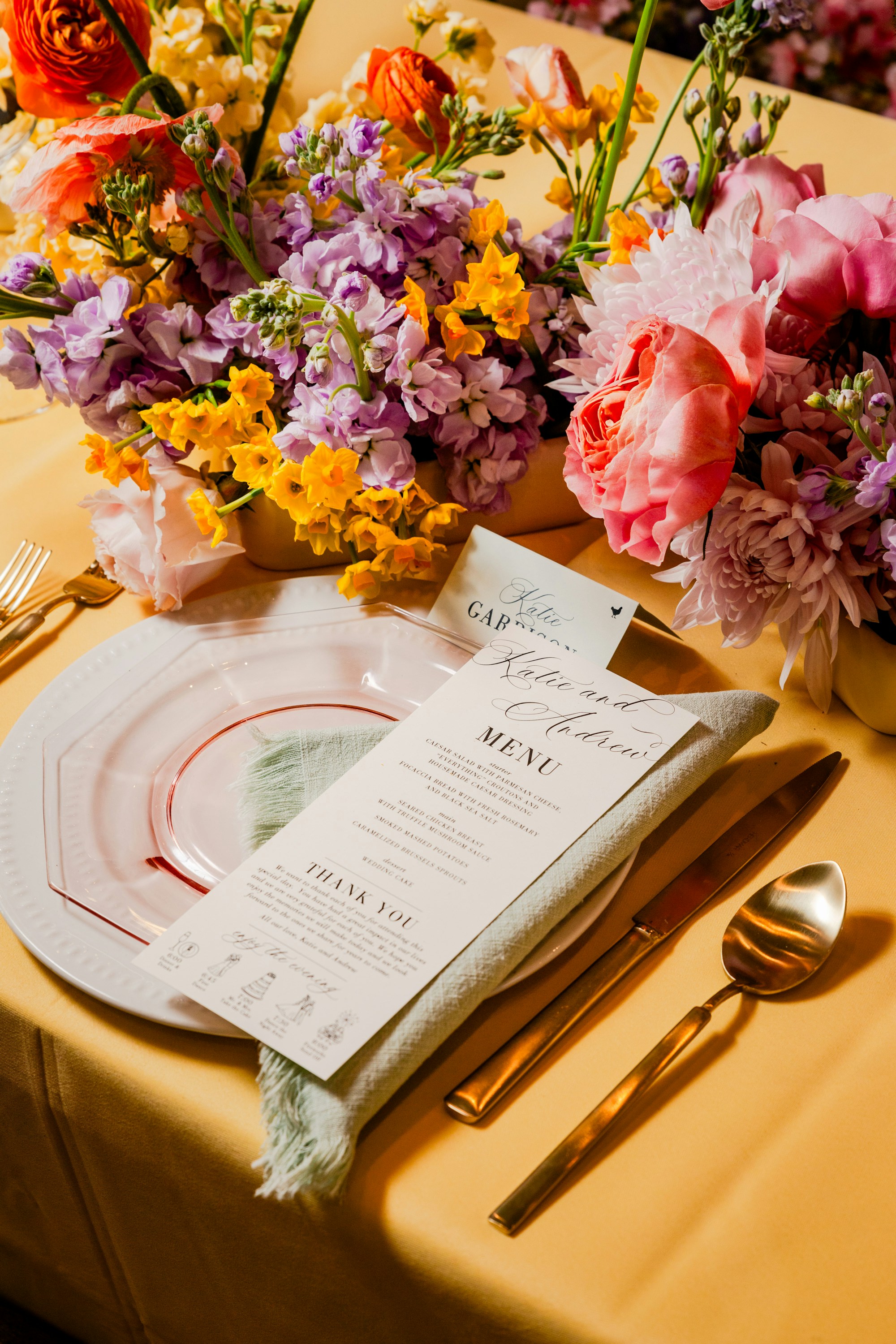 Cascading tablescape arrangement with greenery