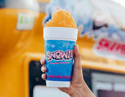 Close-up of colorful fluffy shaved ice cups with vibrant flavors