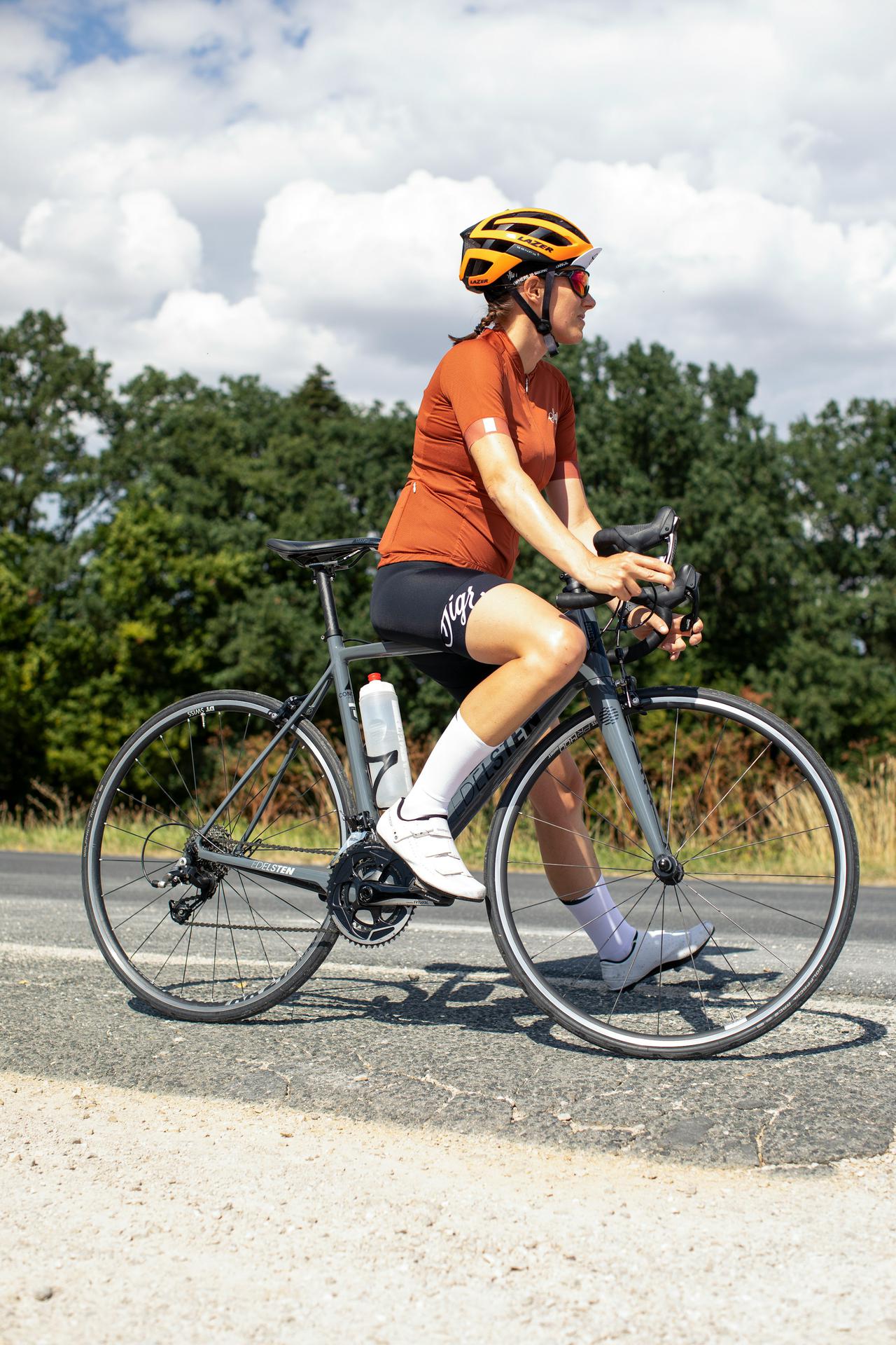 Sportive woman with road bike