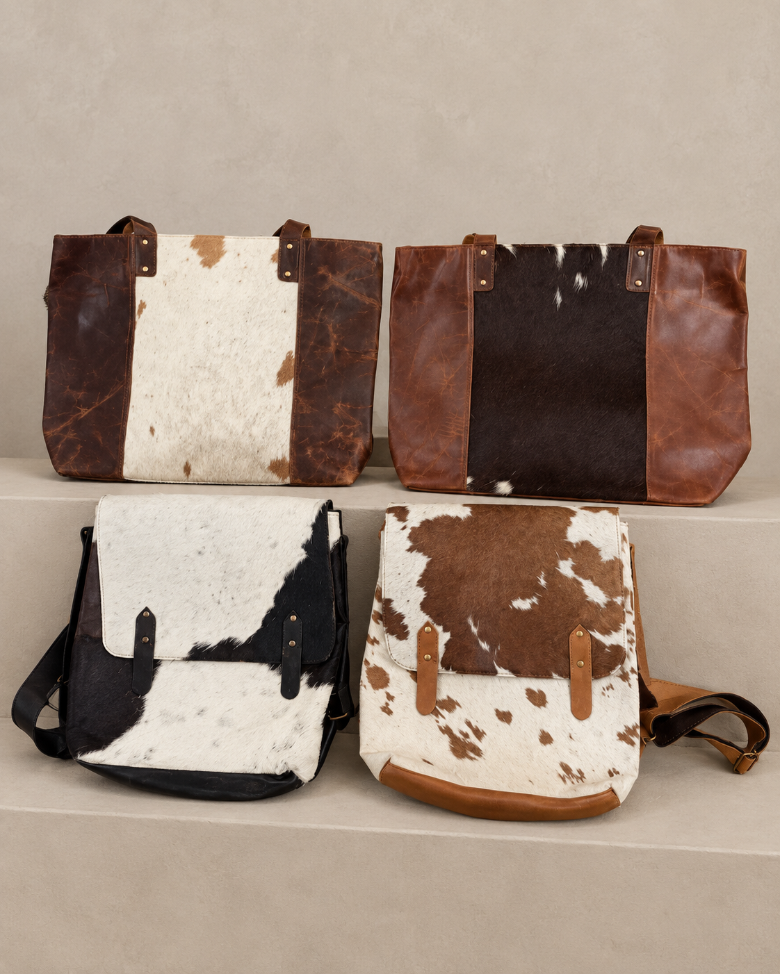The pictured cowhide totes and flap bags in brown, cream and black
