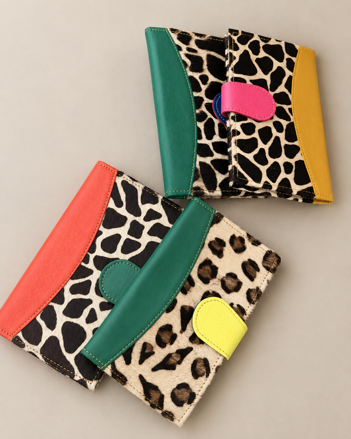 Animal-print wallets with colorful leather accents, made in Brazil