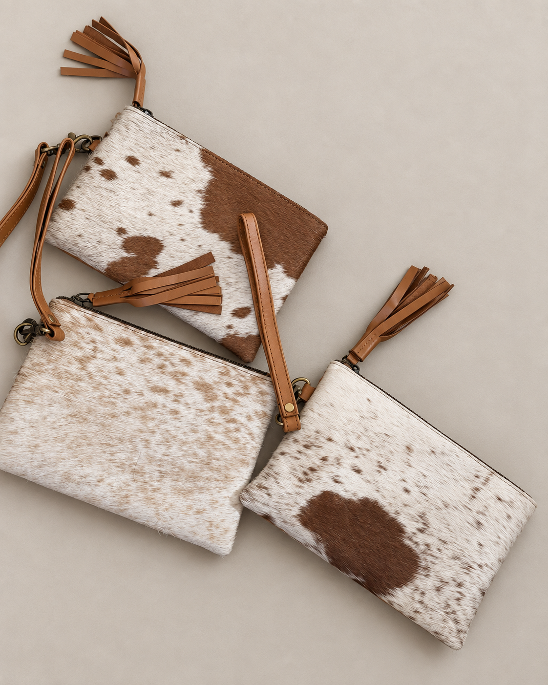 Cowhide wristlets with leather straps and tassels, made in Brazil