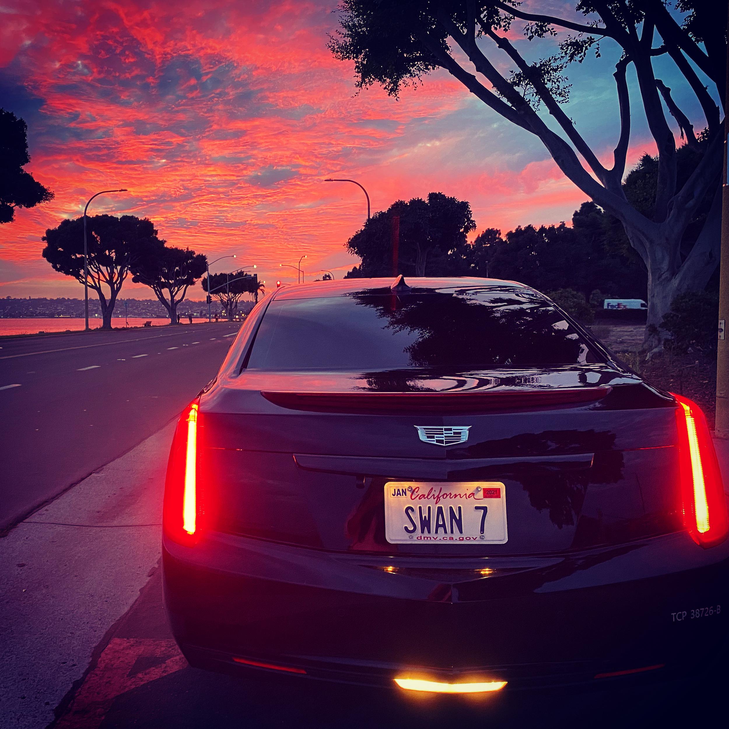 A car on the road as the sun sets. When choosing a private driver service, it's essential to understand precisely what you need to get precisely what you need.