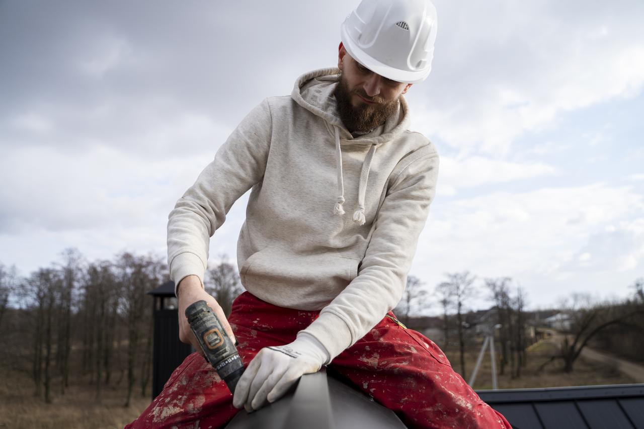 medium-shot-roofer-working-with-protection-helmet.jpg