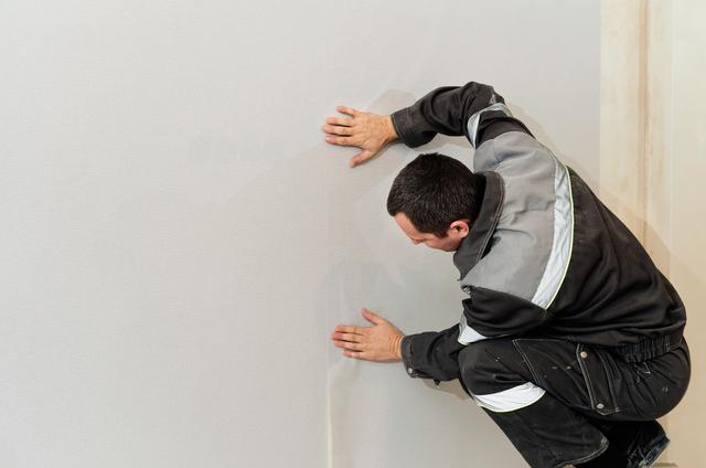 wall-repairman-is-finishing-wallpapering-left-there-is-place-inscription-wallpapering-home-home-restoration-concept.jpg