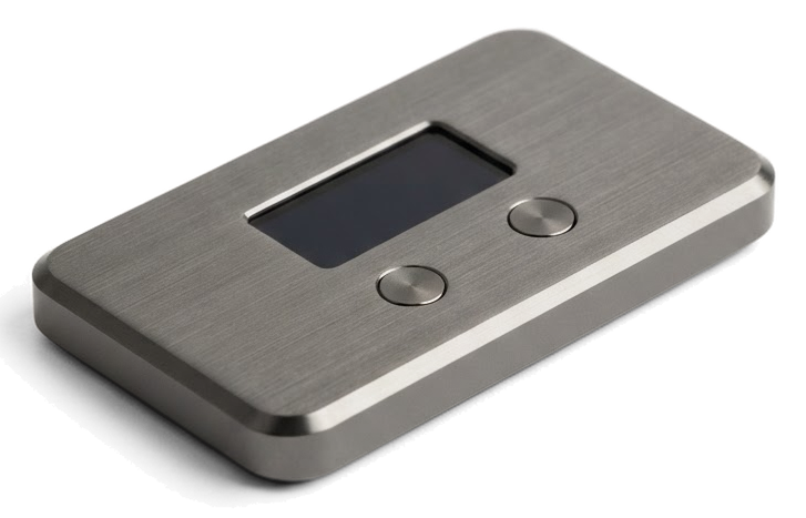 A compact graphite hardware wallet device, shown at an angle