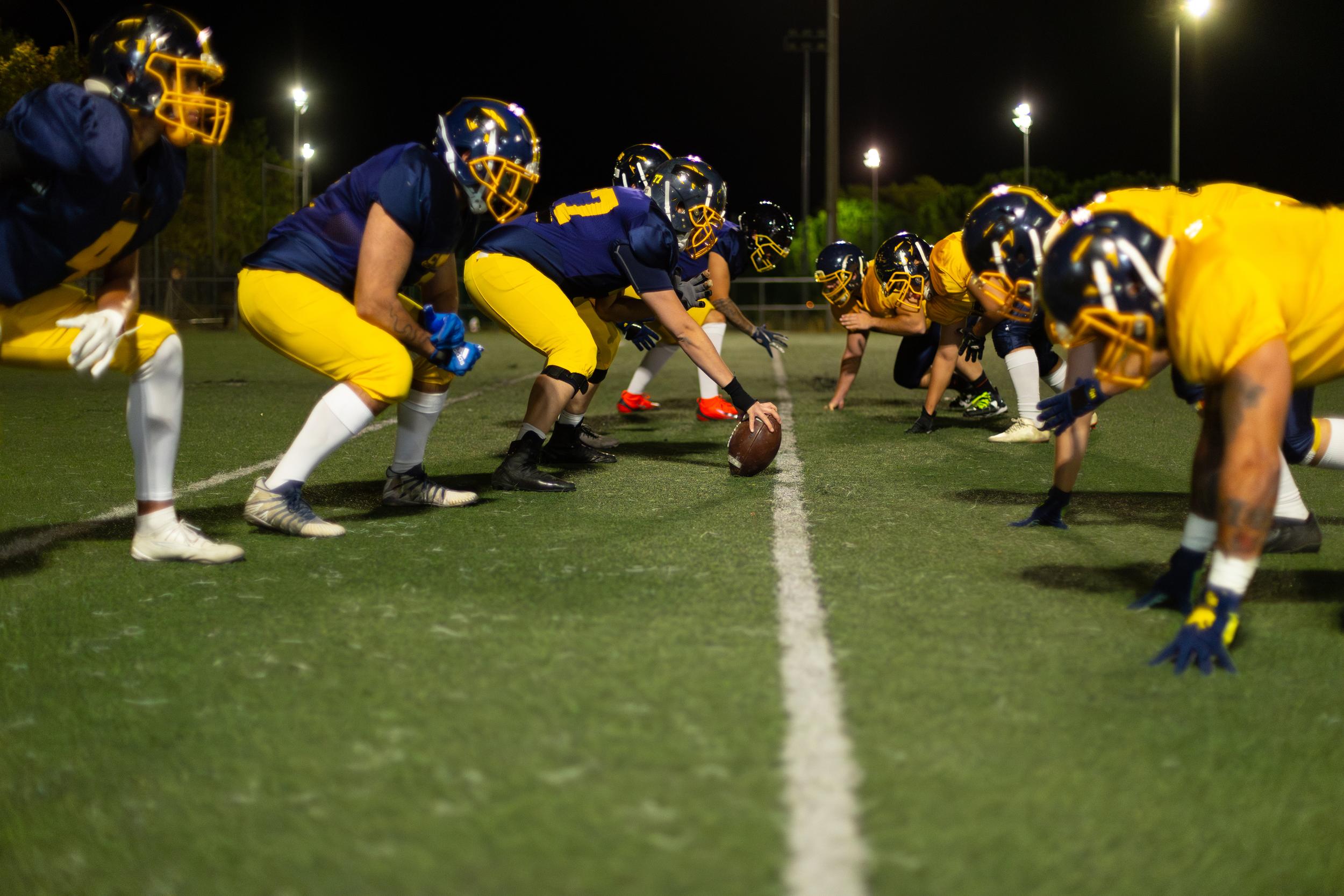american-football-players-line-up-for-a-play-2026-03-25-22-56-19-utc.jpg