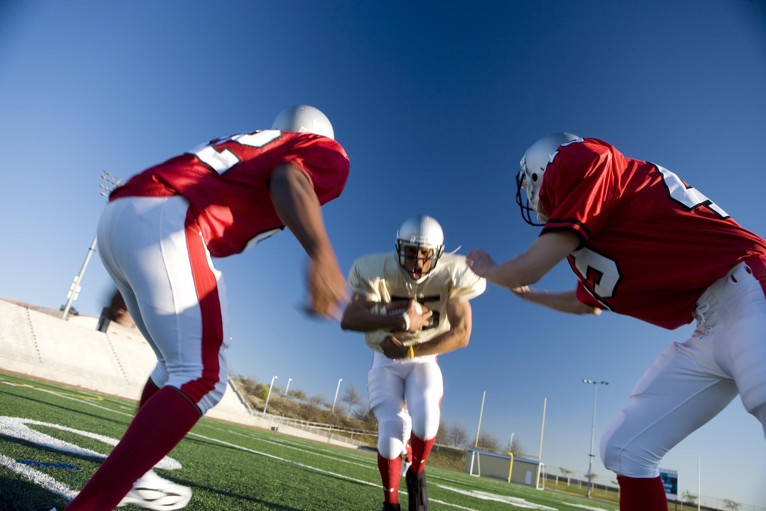 focused-football-players-in-action-on-a-sunny-fiel-2026-01-11-08-06-31-utc.jpg