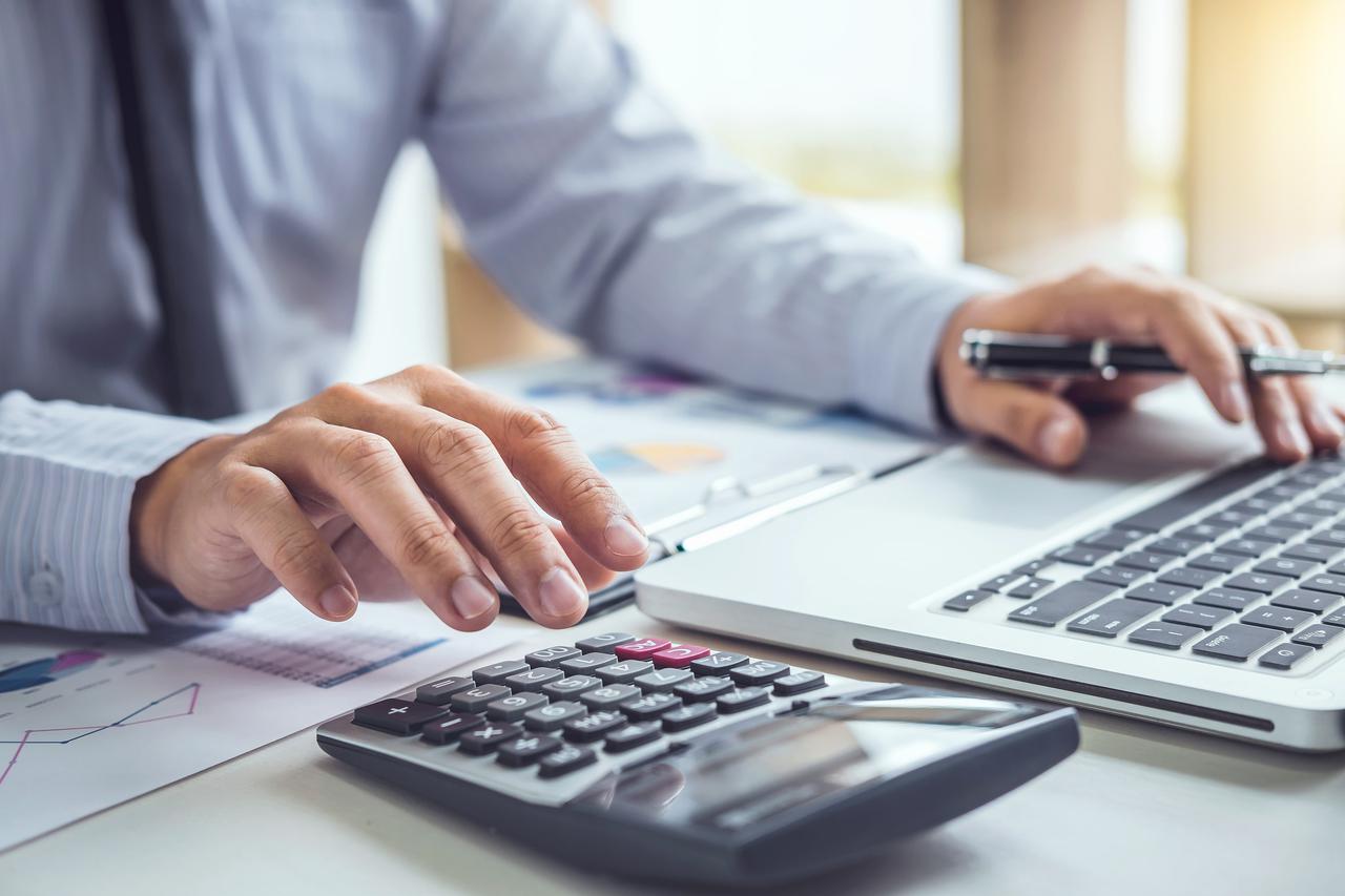 bigstock-business-man-or-accountant-wor-245179174-min.jpg
