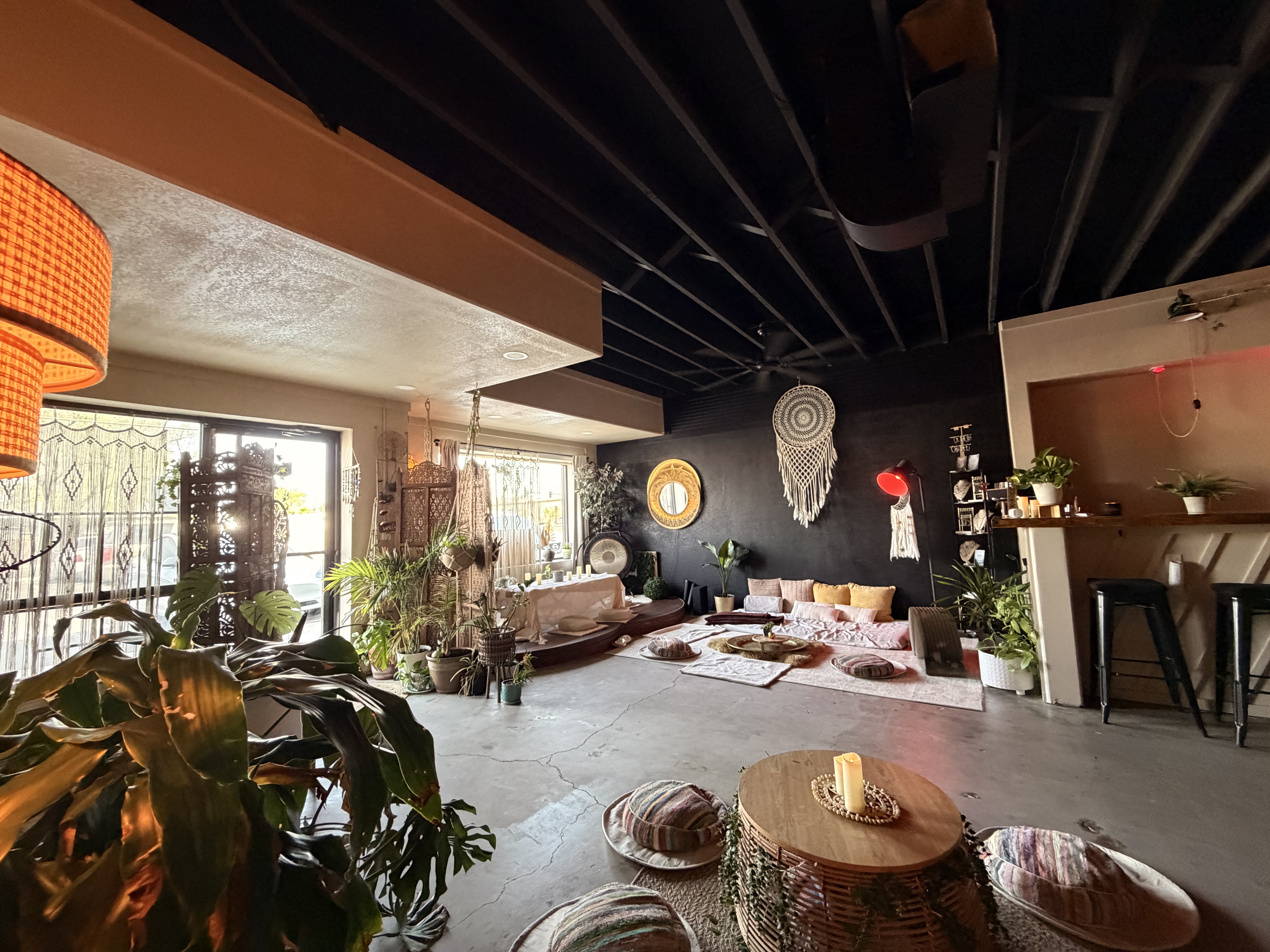 Warm candlelit interior with soft lighting and natural textures inside House of MK AZ