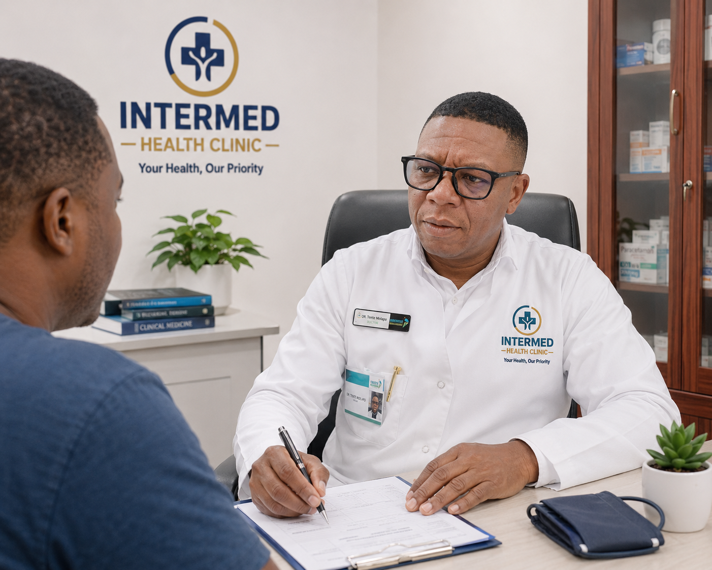 Healthcare professional conducting normal consultation with patient