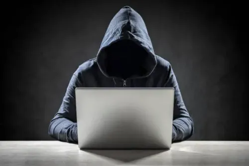 computer-hacker-stealing-data-from-a-laptop.webp