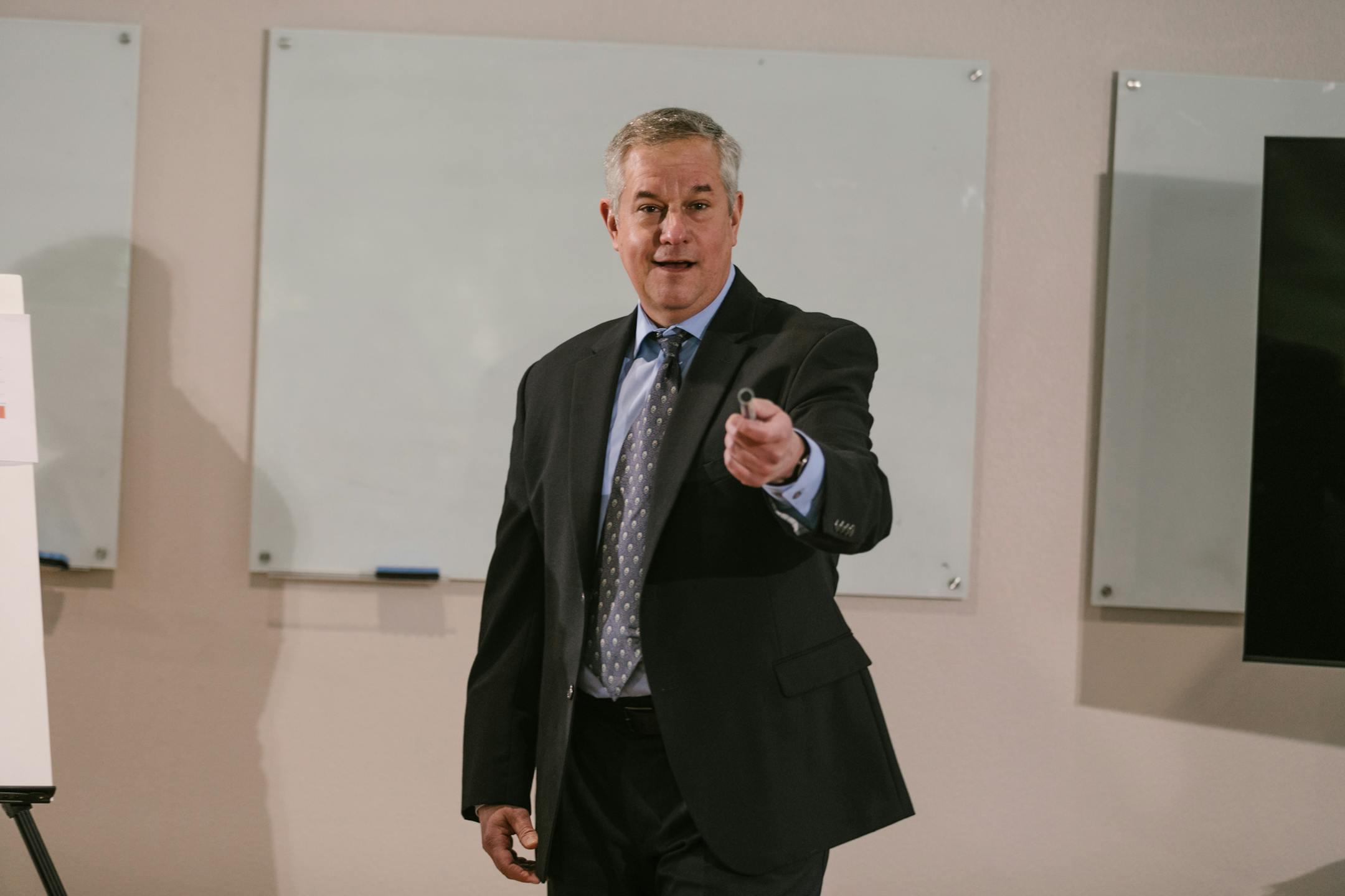Professional presenter delivering a business talk in a conference room.