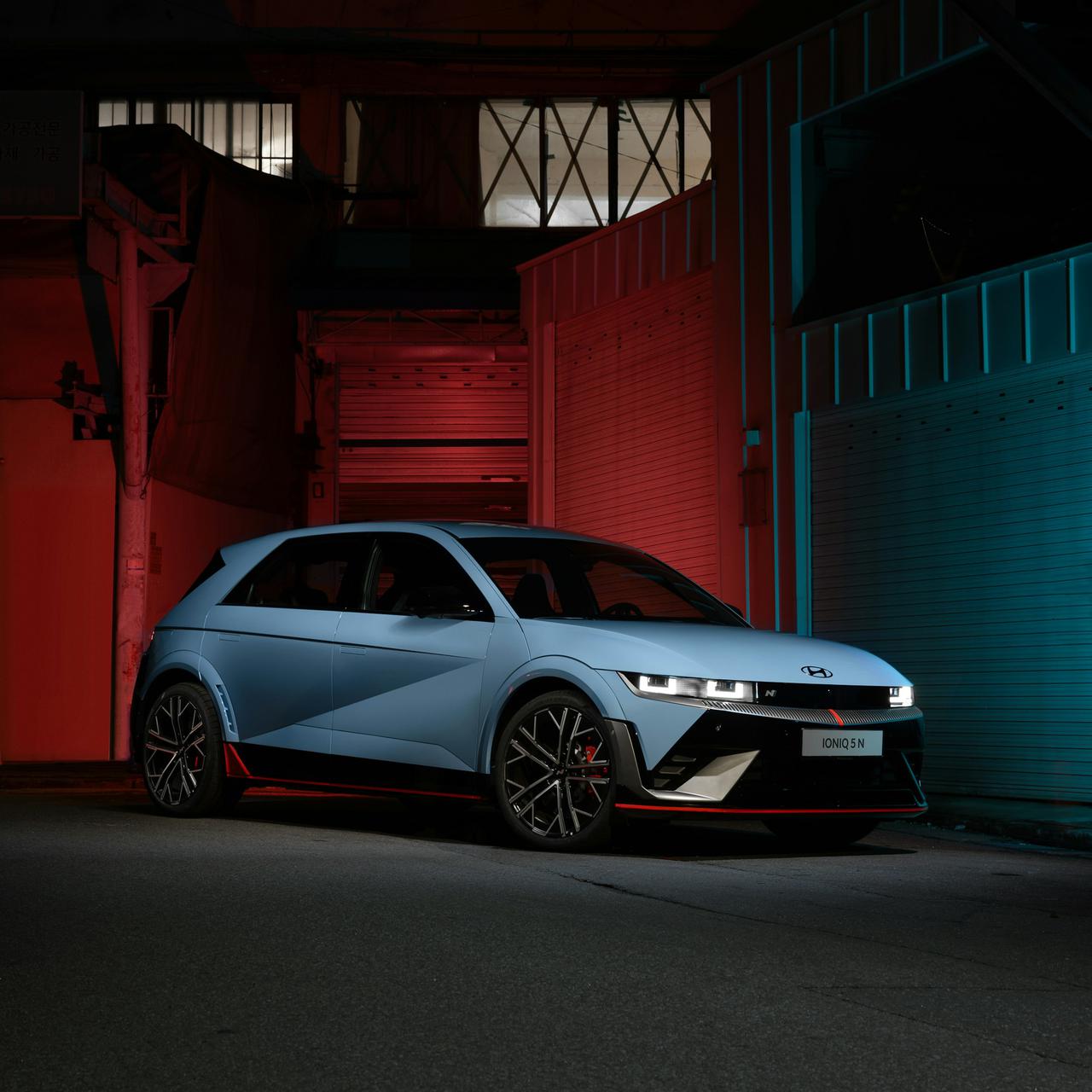The right front view of the Hyundai IONIQ 5 N parked in outside in the dark night.