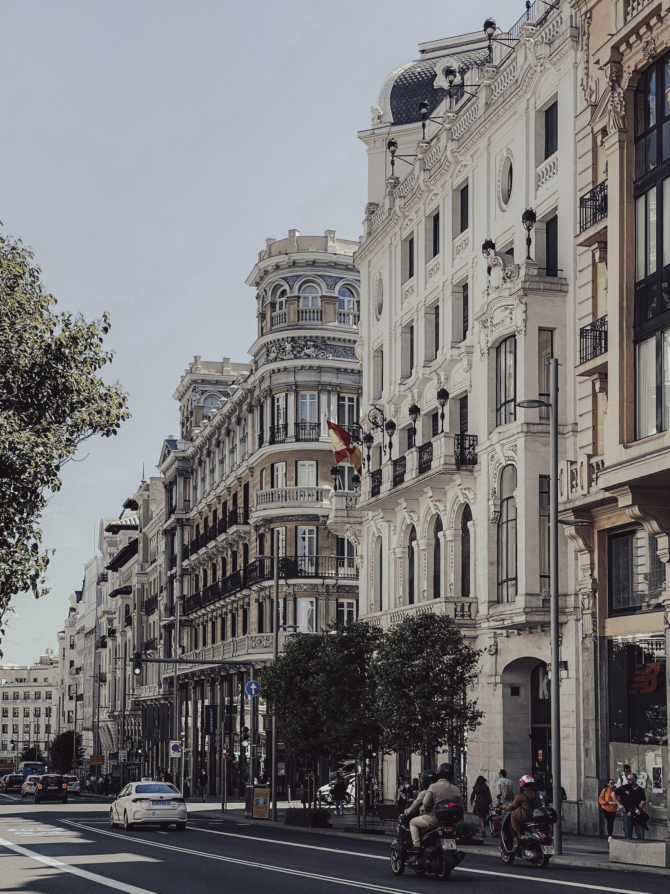 Beautiful city street featuring historic European architecture and bustling urban life.