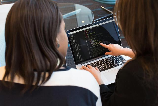 Two women working together on insurance consulting services