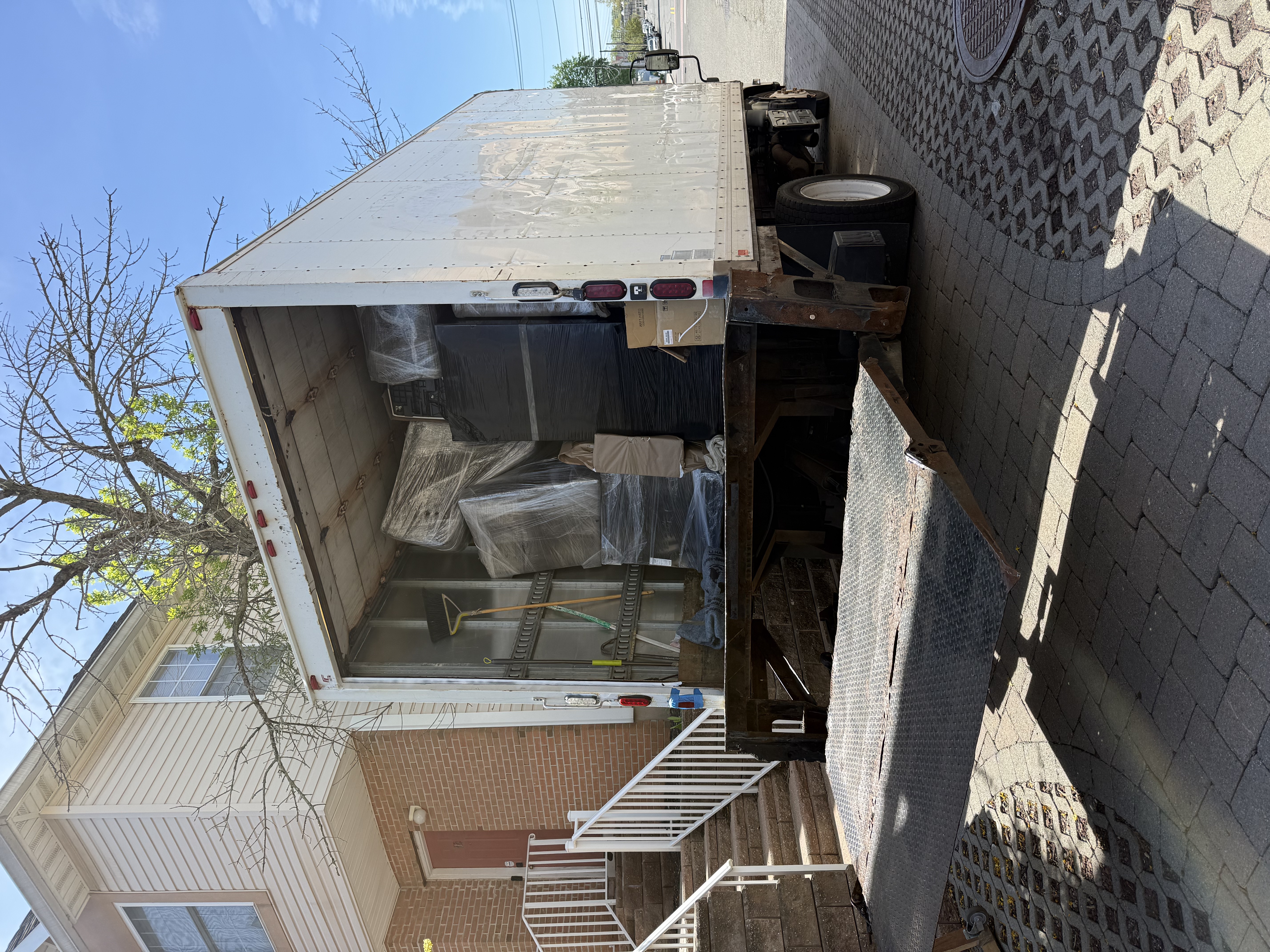 Professional local movers loading furniture into moving truck