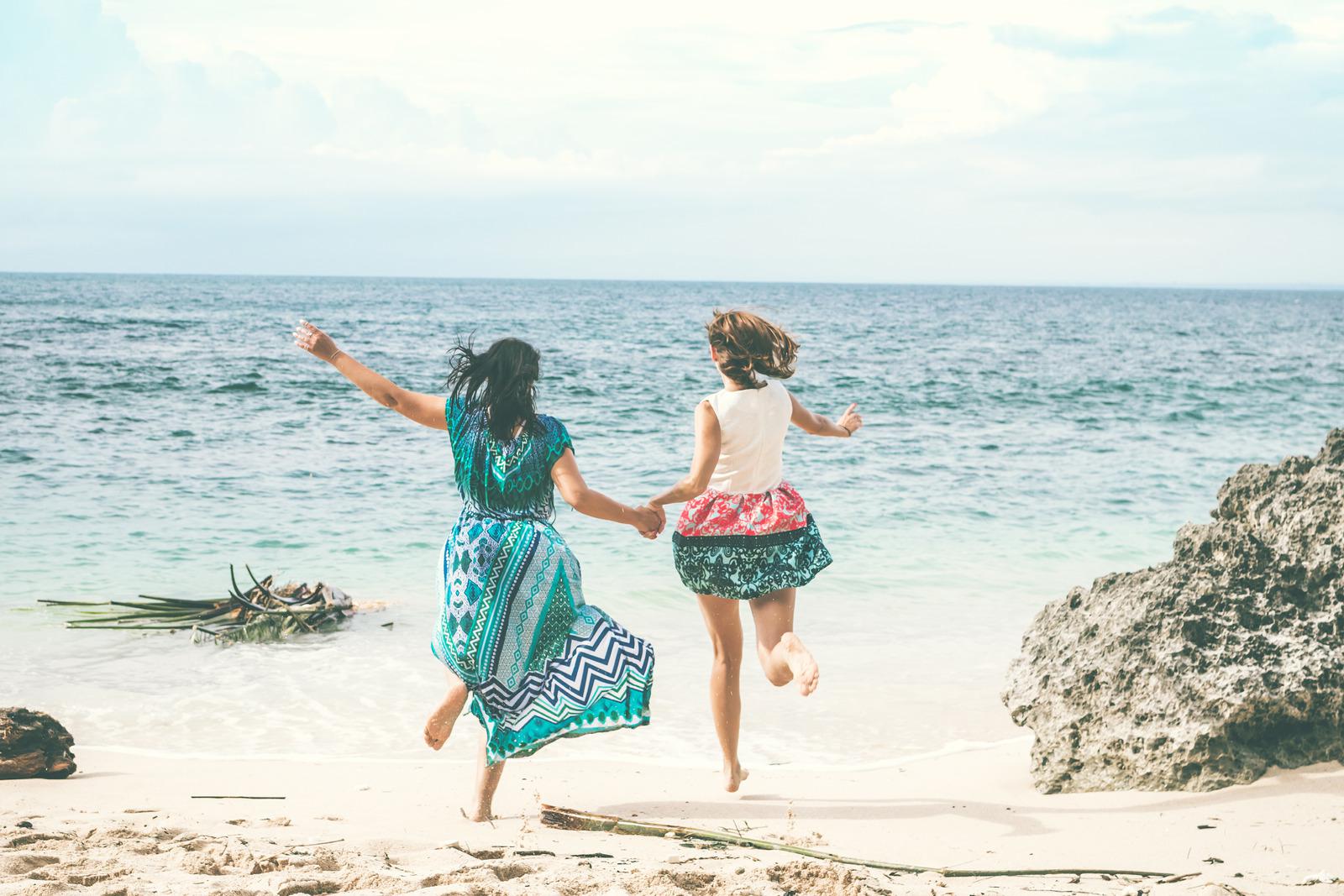 canva-two-women-running-at-the-beach-madyra4r_rg.jpg