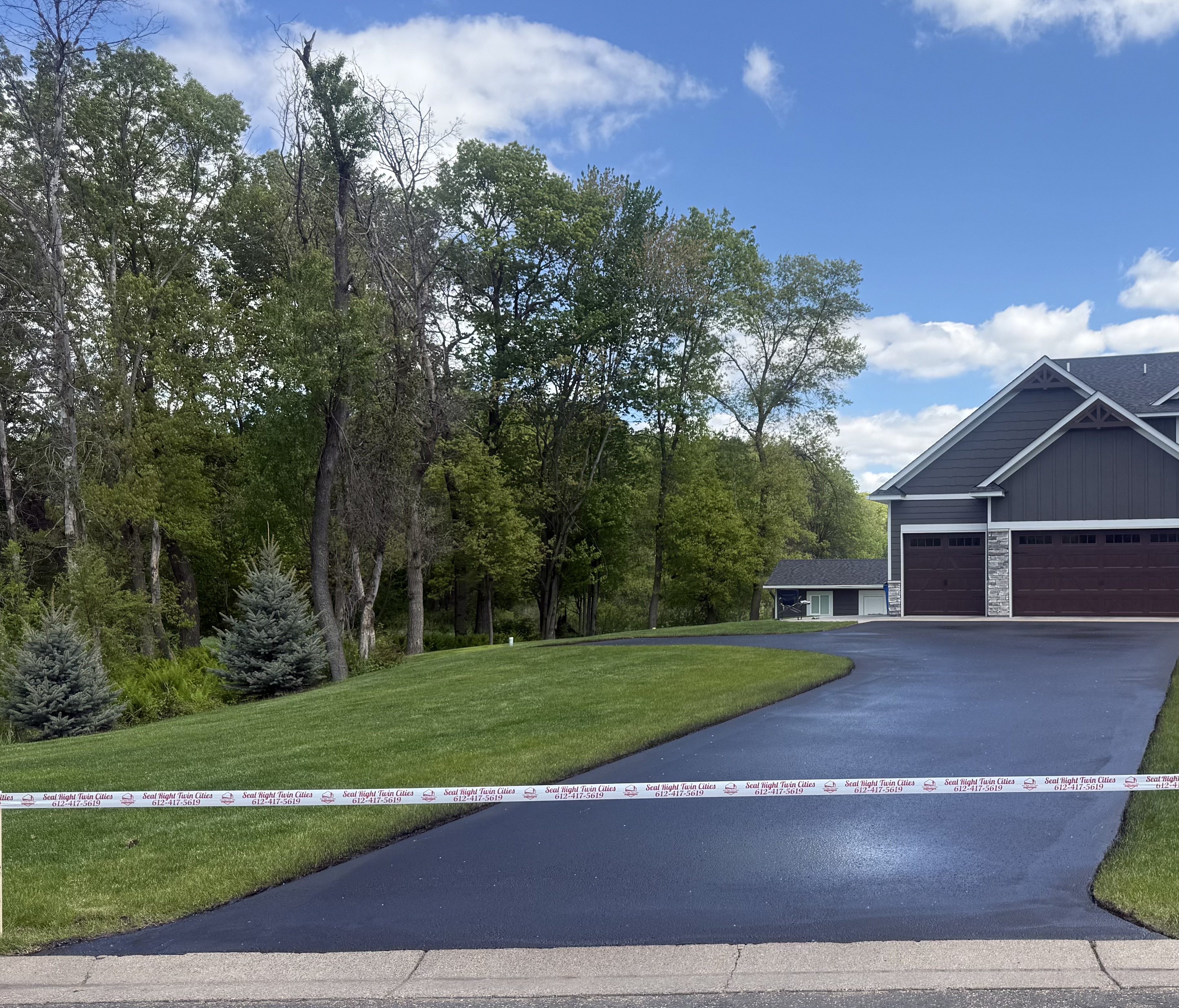 Freshly sealed asphalt driveway