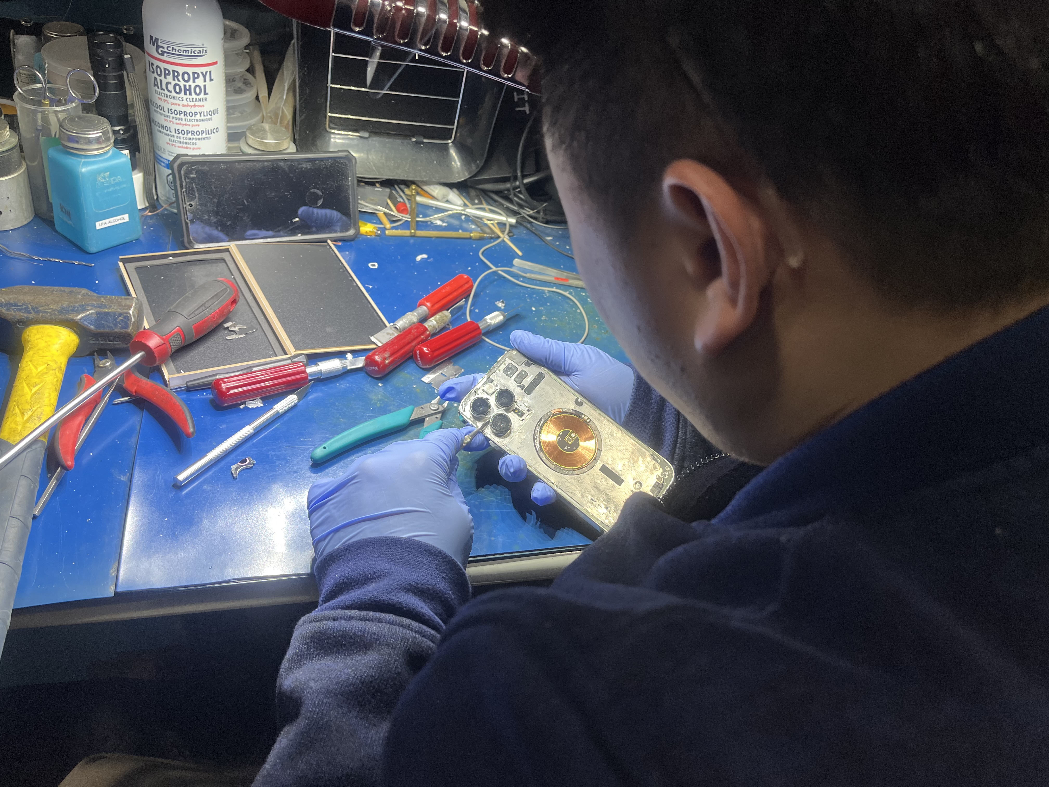 Professional technician repairing mobile device