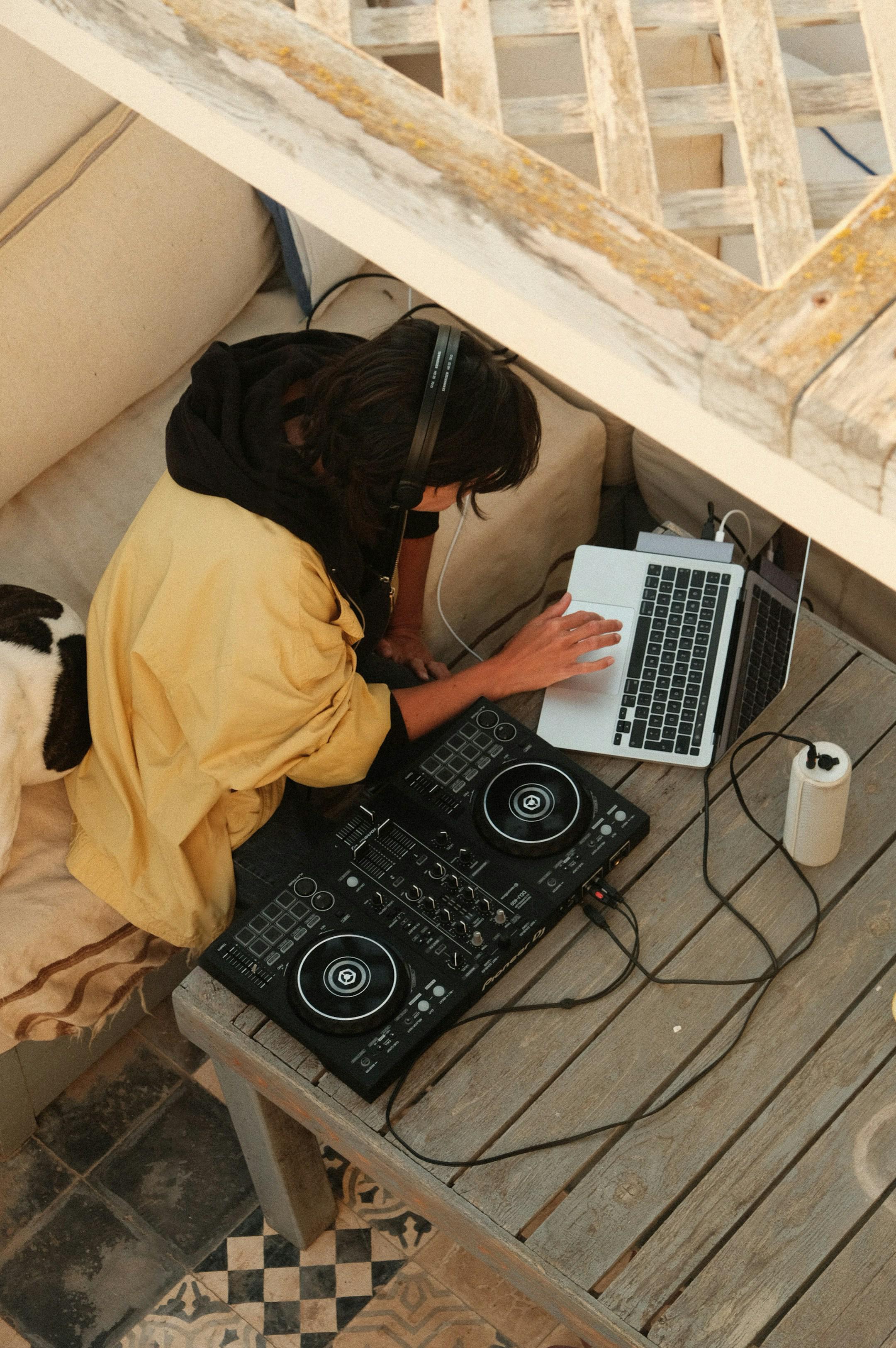 A woman preparing to DJ on a rooftop in Morocco