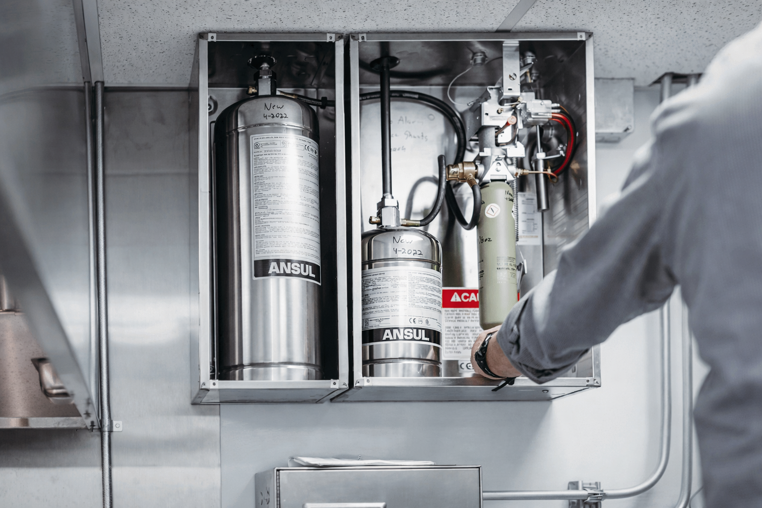 Modern commercial kitchen with professional fire suppression equipment