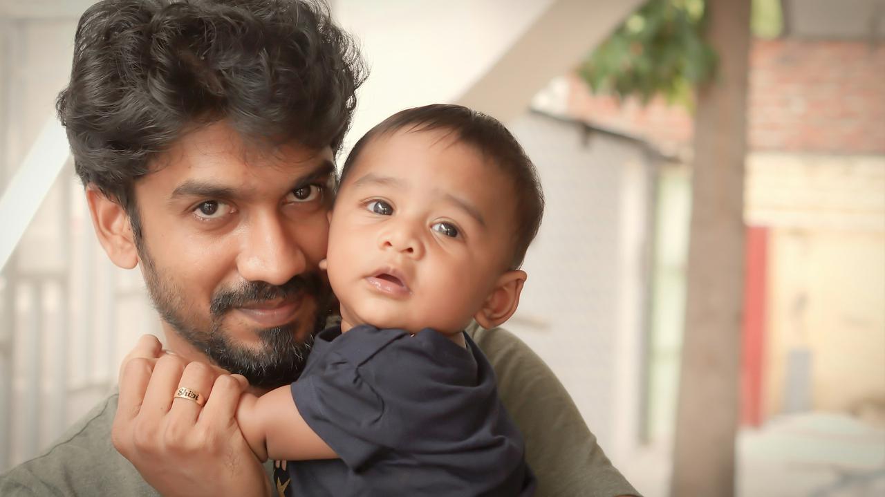 Dad and son - Father holding his baby son in his hand