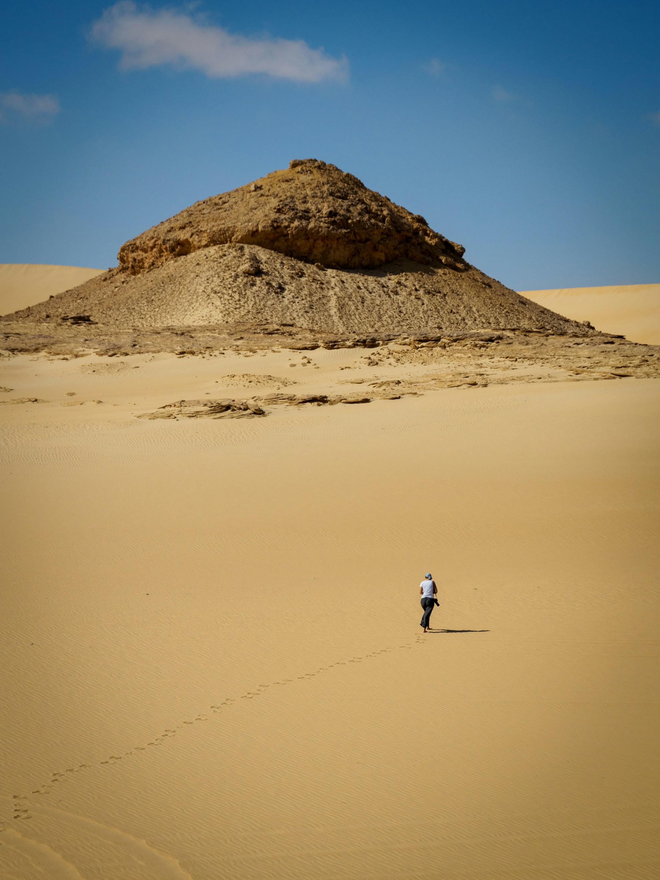 a woman taking a walk in the desert near Siwa, Egypt