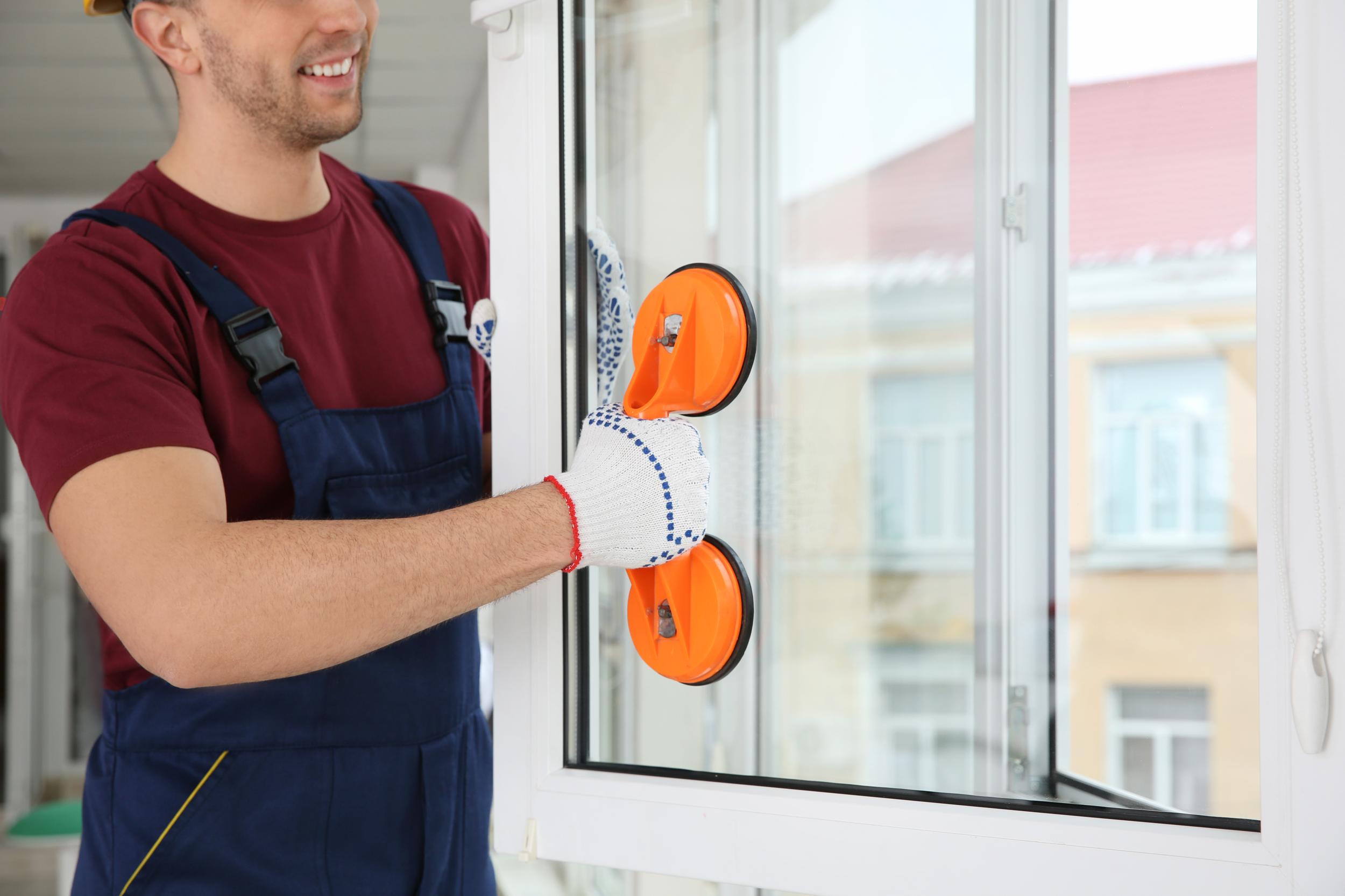 professional-man-installs-replacement-window-at-re-2026-03-12-15-58-34-utc.jpg