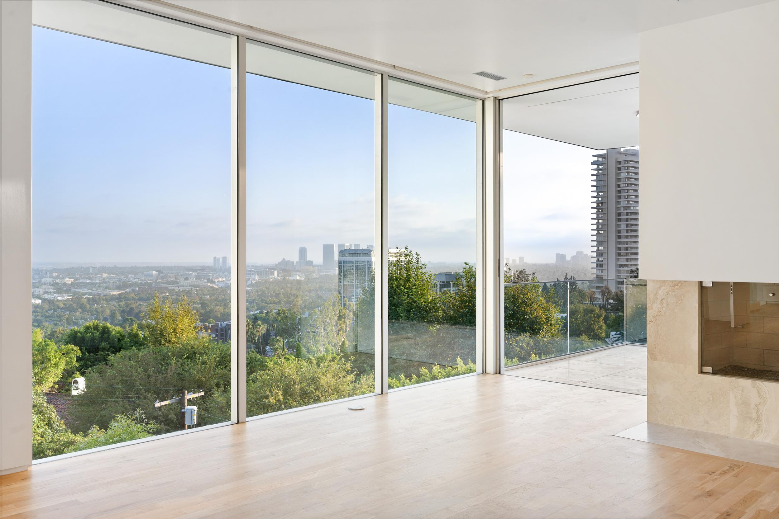 urban-skyline-view-from-modern-home-interior-2026-03-18-16-15-54-utc.jpg